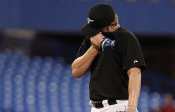 TORONTO, ON - SEPTEMBER 28: Kyle Drabek #4 of the Toronto Blue Jays regroups after a run scores against the New York Yankees during an MLB game at the Rogers Centre September 28, 2010 in Toronto, Ontario, Canada. (Photo by Abelimages/Getty Images)