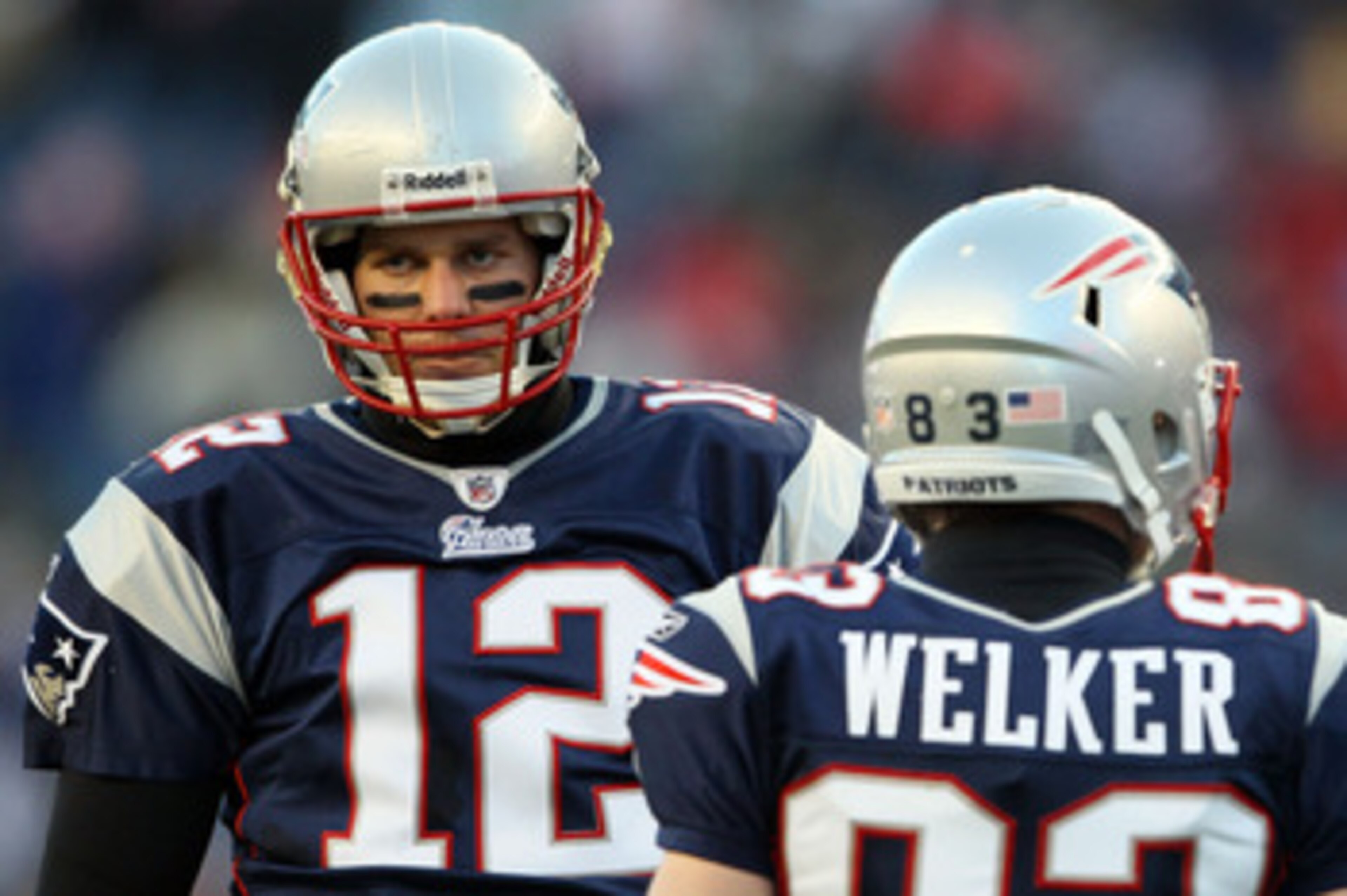 FOXBORO, MA - JANUARY 16:  Tom Brady #12 and Wes Welker #83 of the New England Patriots look on during their 2011 AFC divisional playoff game against the New York Jets at Gillette Stadium on January 16, 2011 in Foxboro, Massachusetts.  (Photo by Elsa/Gett