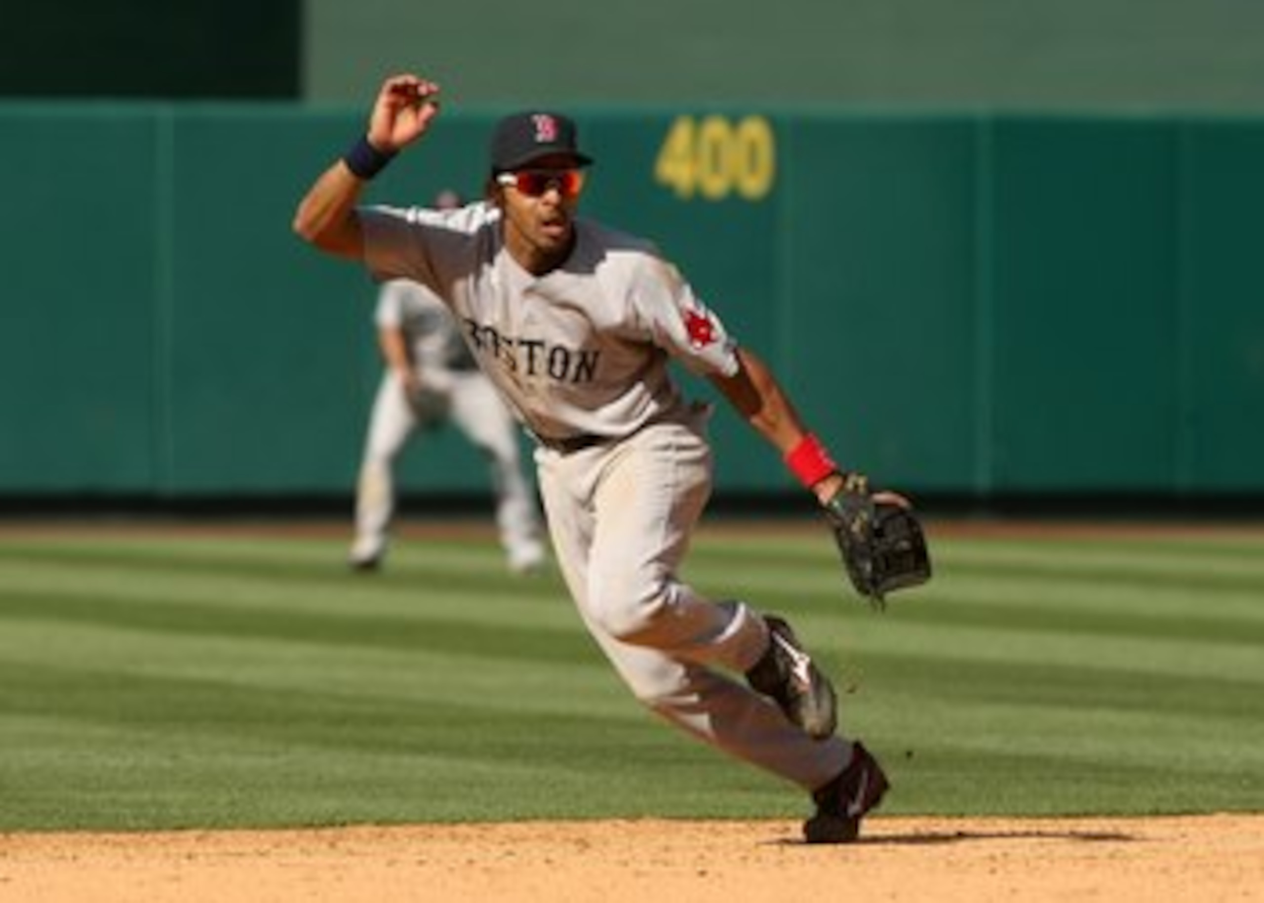 ANAHEIM, CA - MAY 14: Shortstop Julio Lugo #23 of the Boston Red Sox plays in the field against the Los Angeles Angels of Anaheim on May 14, 2009 at Angel Stadium in Anaheim, California. The Angels won 5-4 in 12 innings. (Photo by Stephen Dunn/Getty Im ANAHEIM, CA - MAY 14: Shortstop Julio Lugo #23 of the Boston Red Sox plays in the field against the Los Angeles Angels of Anaheim on May 14, 2009 at Angel Stadium in Anaheim, California. The Angels won 5-4 in 12 innings. (Photo by Stephen Dunn/Getty Im