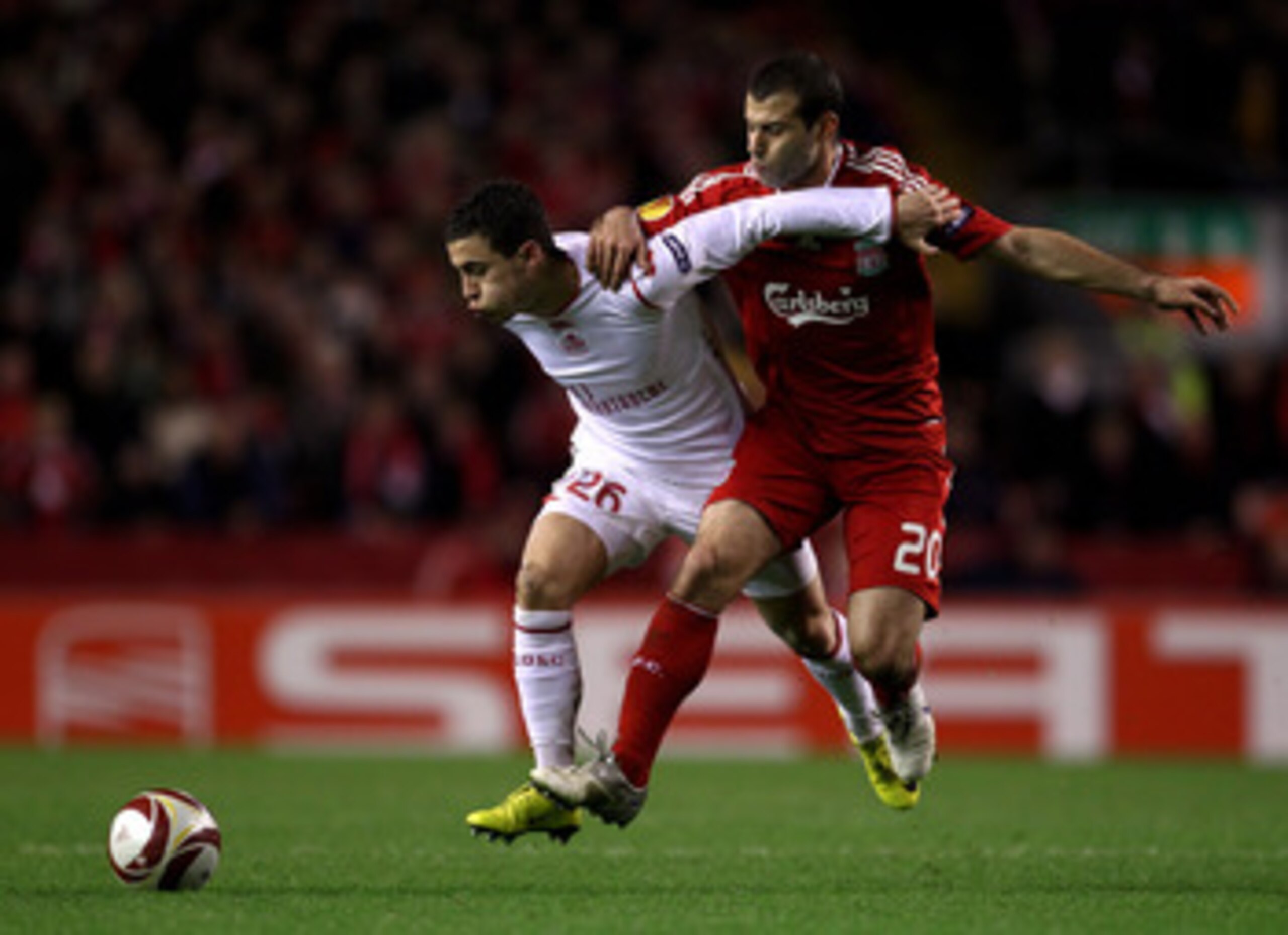 LIVERPOOL, ENGLAND - MARCH 18:  Javier Mascherano of Liverpool battles for the ball with Eden Hazard of Lille during the UEFA Europa League Round of 16, second leg match at Anfield on March 18, 2010 in Liverpool, England.  (Photo by Alex Livesey/Getty Ima