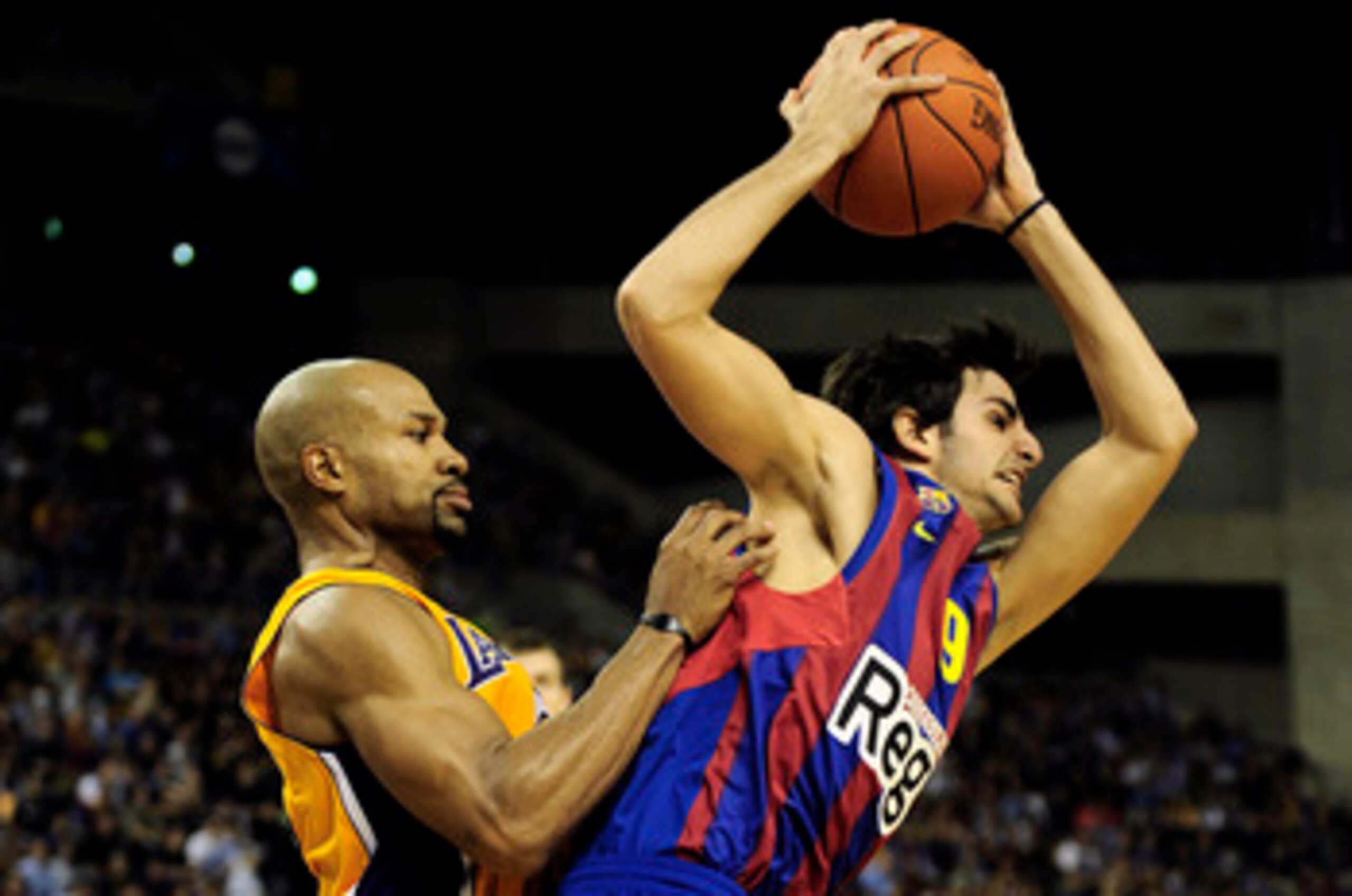 BARCELONA, SPAIN - OCTOBER 07:  Ricky Rubio (R) #9 of the FC Barcelona duels  for a ball against Derek Fisher #2 of the Los Angeles Lakers during the NBA Europe Live match between Los Angeles Lakers and Regal FC Barcelona at the at Palau Blaugrana on Octo