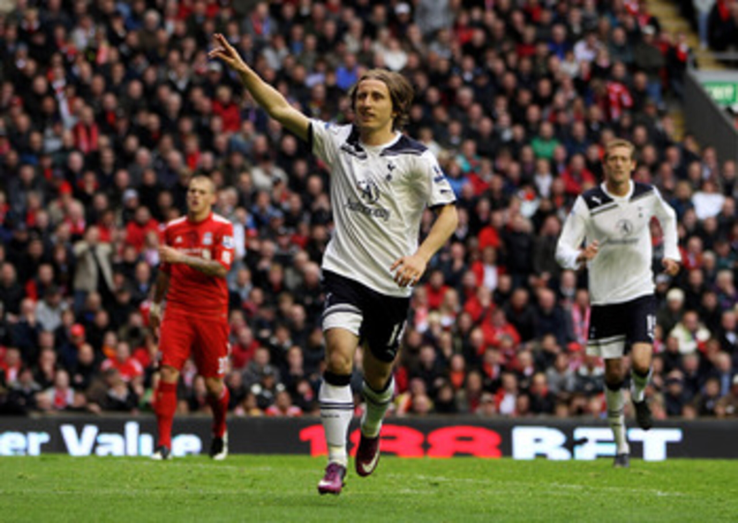 LIVERPOOL, ENGLAND - MAY 15:  Luka Modric of Spurs celebrates after scoring his team's second goal from the penalty spot during the Barclays Premier League match between Liverpool and Tottenham Hotspur at Anfield on May 15, 2011 in Liverpool, England.  (P