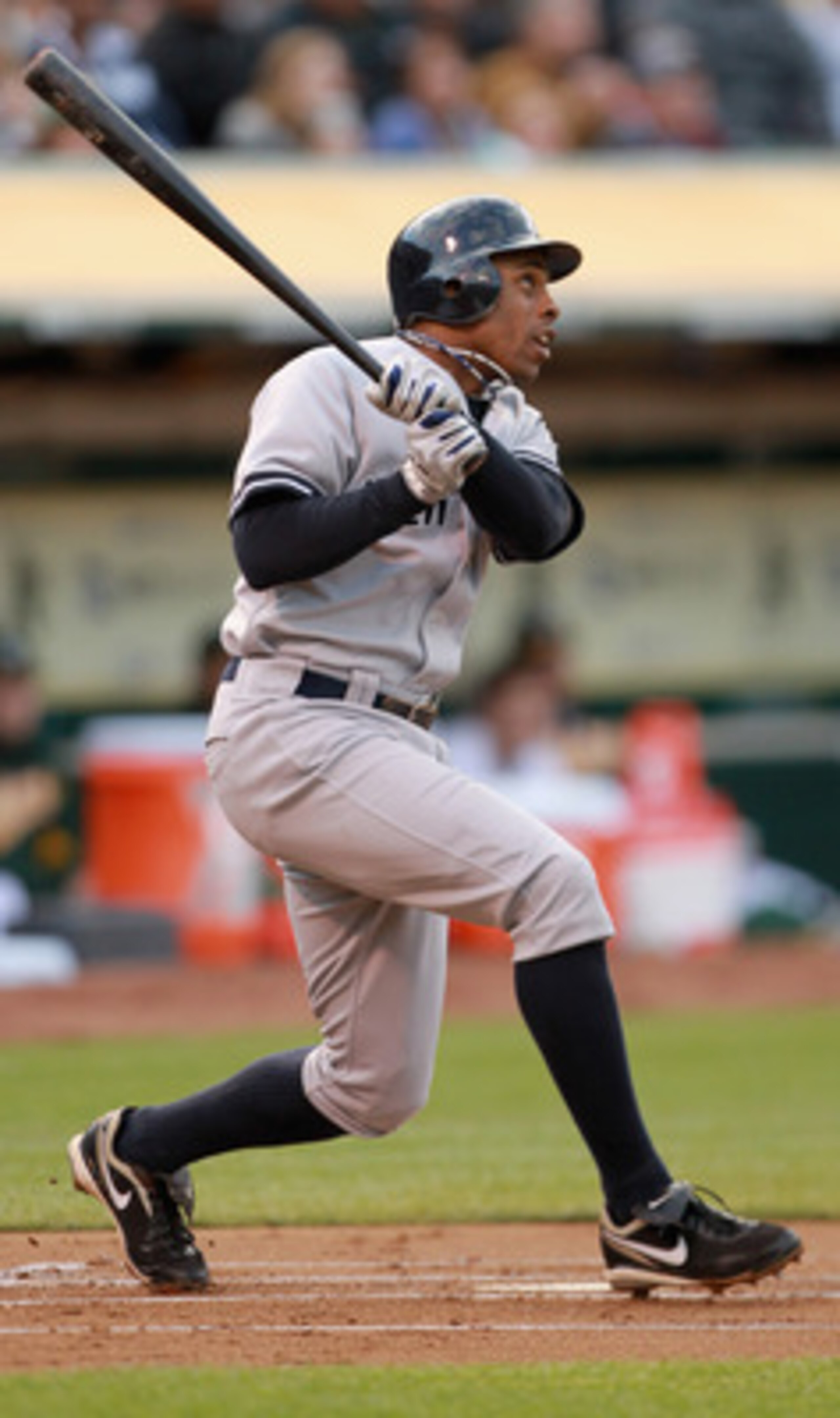 OAKLAND, CA - MAY 31:  Curtis Granderson #14 of the New York Yankees hits a two run home run in the first inning against the Oakland Athletics at Oakland-Alameda County Coliseum on May 31, 2011 in Oakland, California.  (Photo by Ezra Shaw/Getty Images)