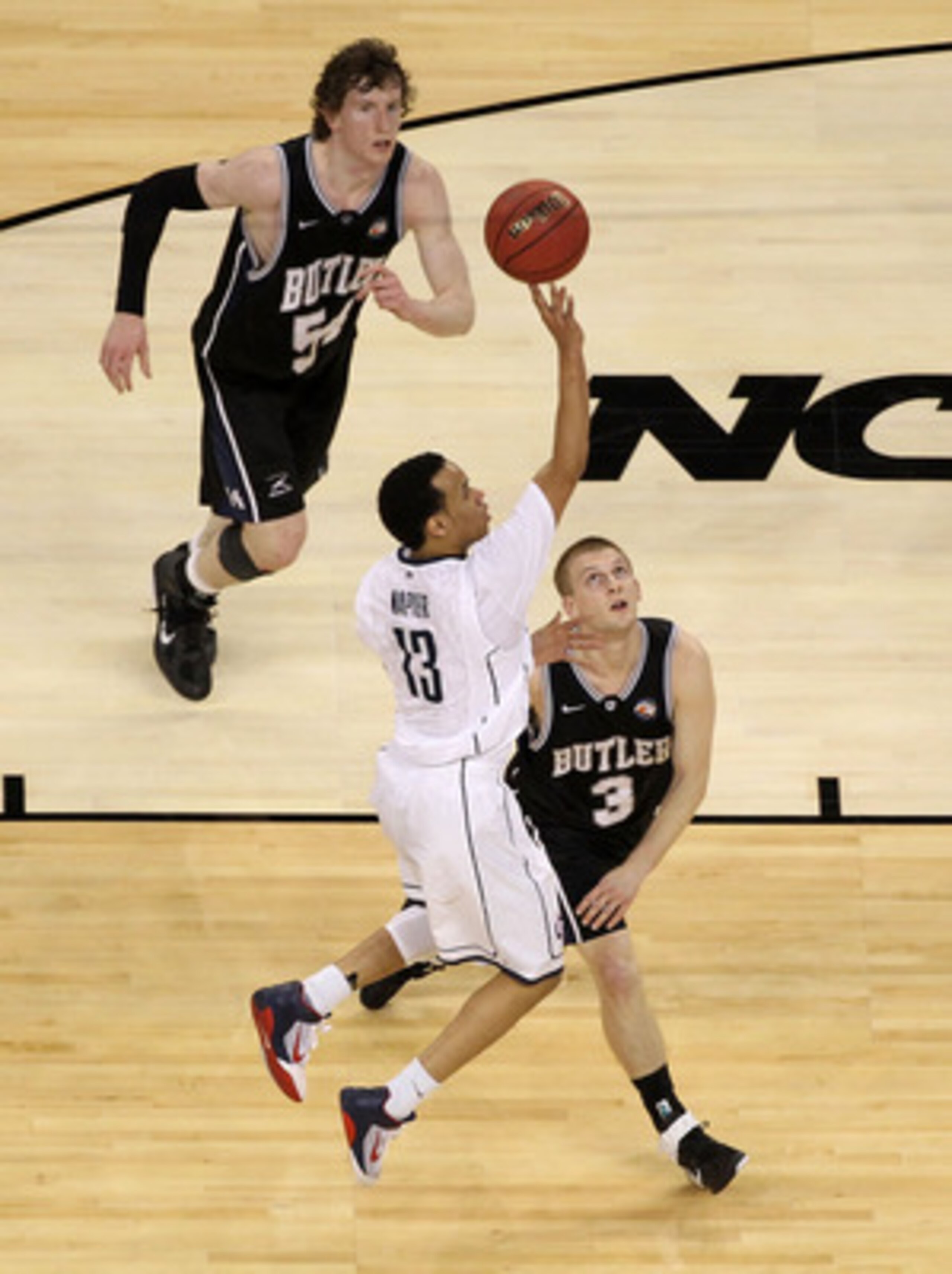 HOUSTON, TX - APRIL 04: Shabazz Napier #13 of the Connecticut Huskies goes up for a shot over Zach Hahn #3 of the Butler Bulldogs during the National Championship Game of the 2011 NCAA Division I Men's Basketball Tournament at Reliant Stadium on April 4, HOUSTON, TX - APRIL 04: Shabazz Napier #13 of the Connecticut Huskies goes up for a shot over Zach Hahn #3 of the Butler Bulldogs during the National Championship Game of the 2011 NCAA Division I Men's Basketball Tournament at Reliant Stadium on April 4,