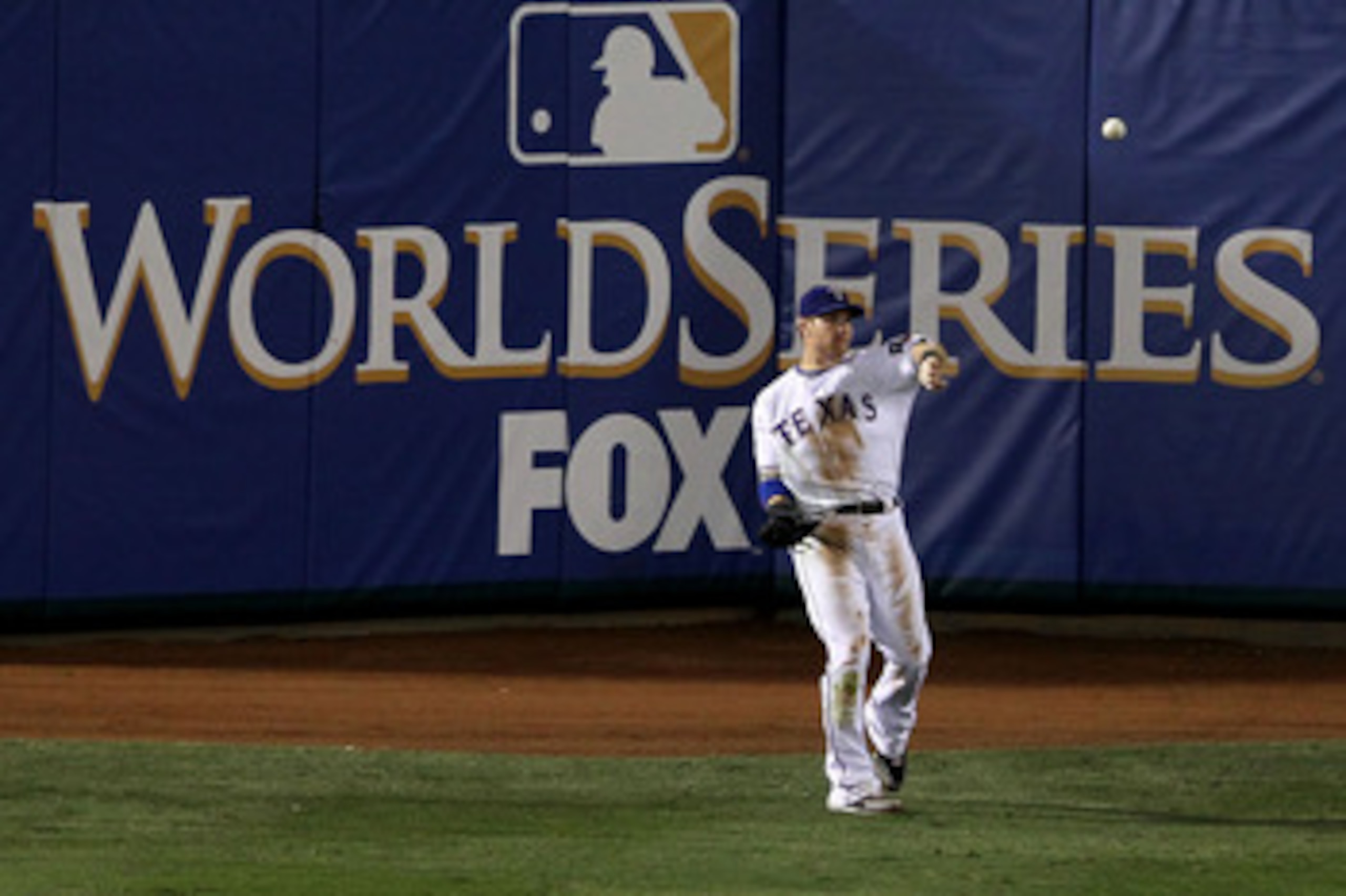 ARLINGTON, TX - OCTOBER 31:  Josh Hamilton #32 of the Texas Rangers throws the ball into the infield after he caught a fly ball for an out against the San Francisco Giants in Game Four of the 2010 MLB World Series at Rangers Ballpark in Arlington on Octob