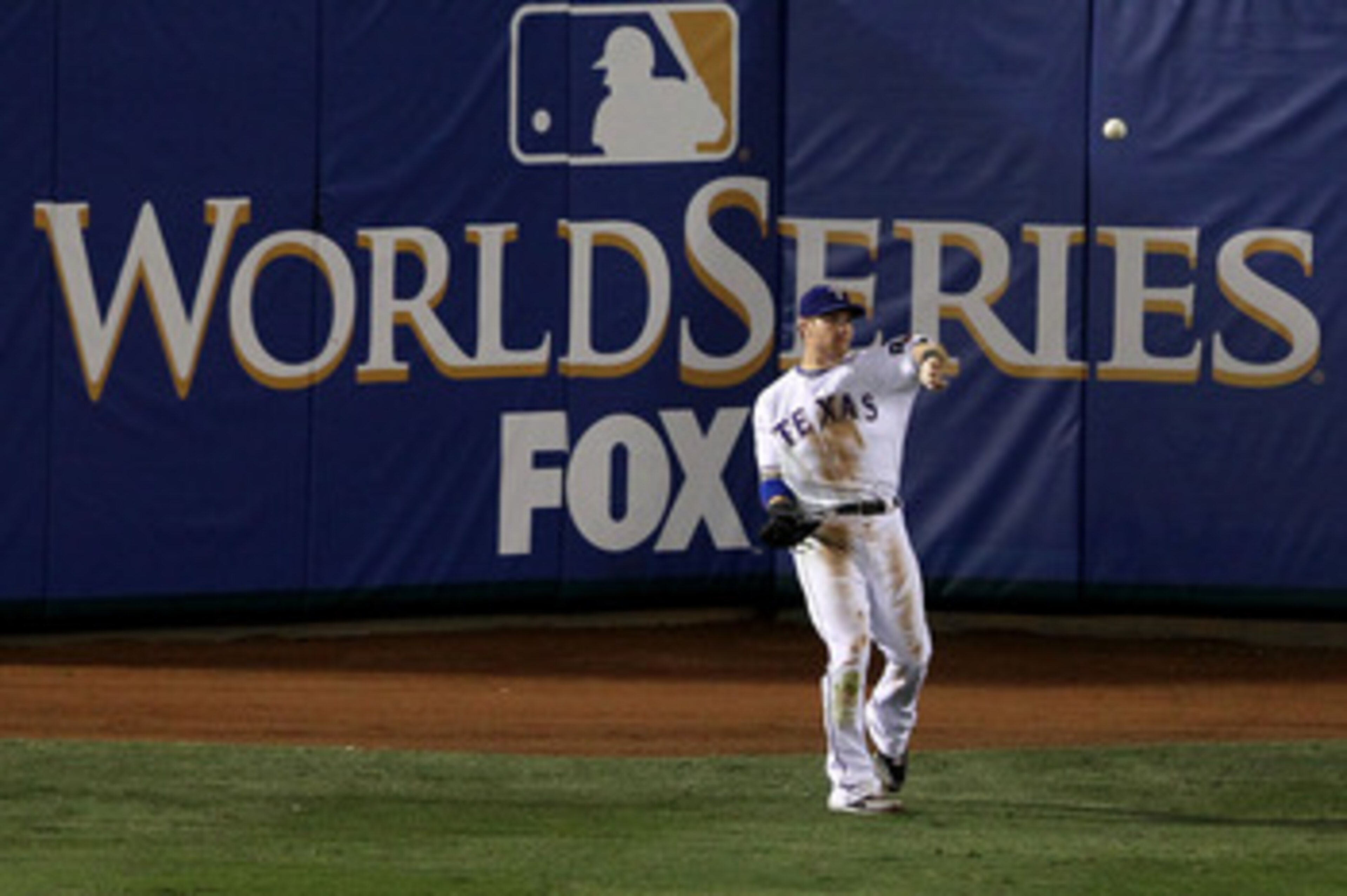 ARLINGTON, TX - OCTOBER 31:  Josh Hamilton #32 of the Texas Rangers throws the ball into the infield after he caught a fly ball for an out against the San Francisco Giants in Game Four of the 2010 MLB World Series at Rangers Ballpark in Arlington on Octob