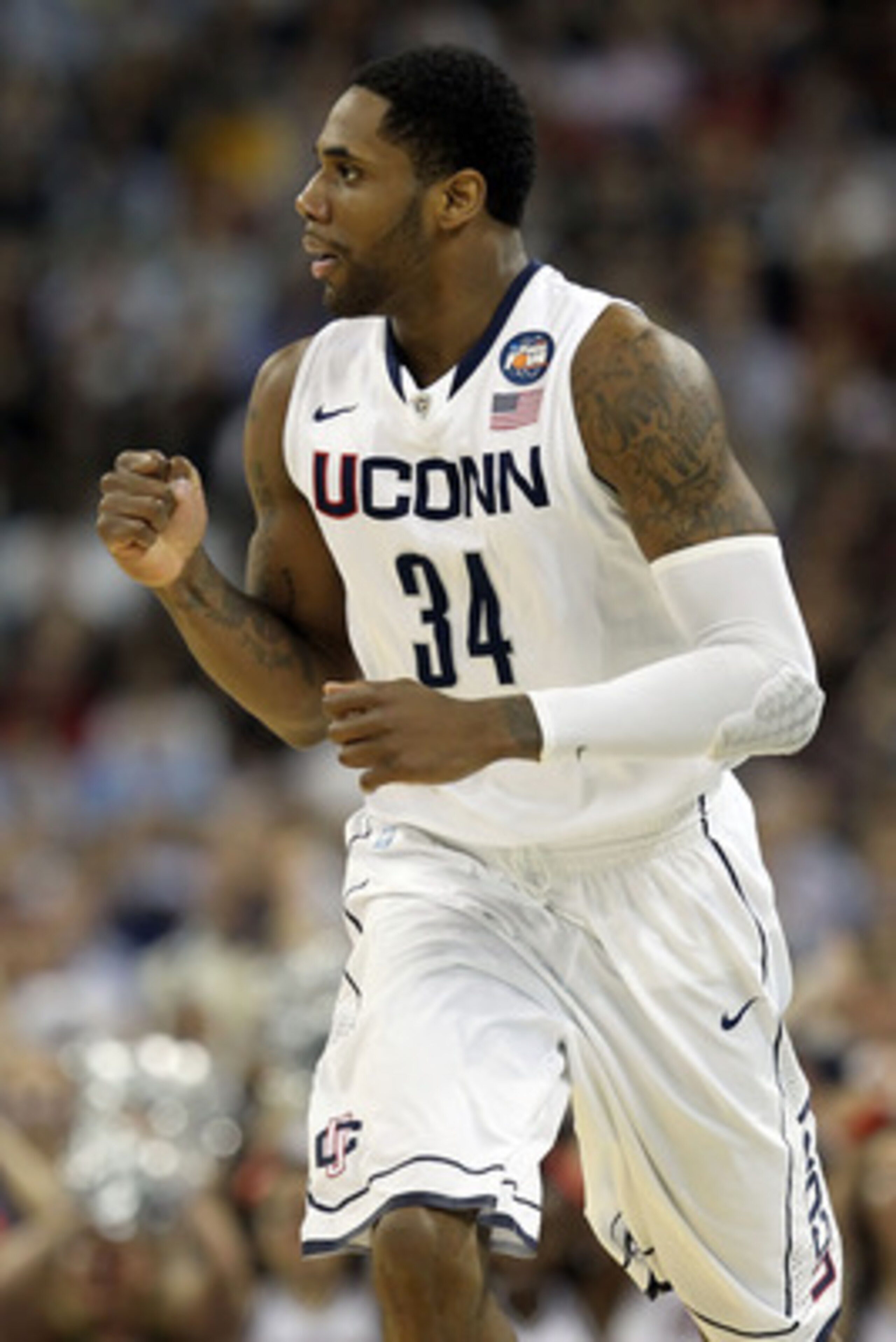HOUSTON, TX - APRIL 04: Alex Oriakhi #34 of the Connecticut Huskies reacts after a dunk against the Butler Bulldogs during the National Championship Game of the 2011 NCAA Division I Men's Basketball Tournament at Reliant Stadium on April 4, 2011 in Houst HOUSTON, TX - APRIL 04: Alex Oriakhi #34 of the Connecticut Huskies reacts after a dunk against the Butler Bulldogs during the National Championship Game of the 2011 NCAA Division I Men's Basketball Tournament at Reliant Stadium on April 4, 2011 in Houst