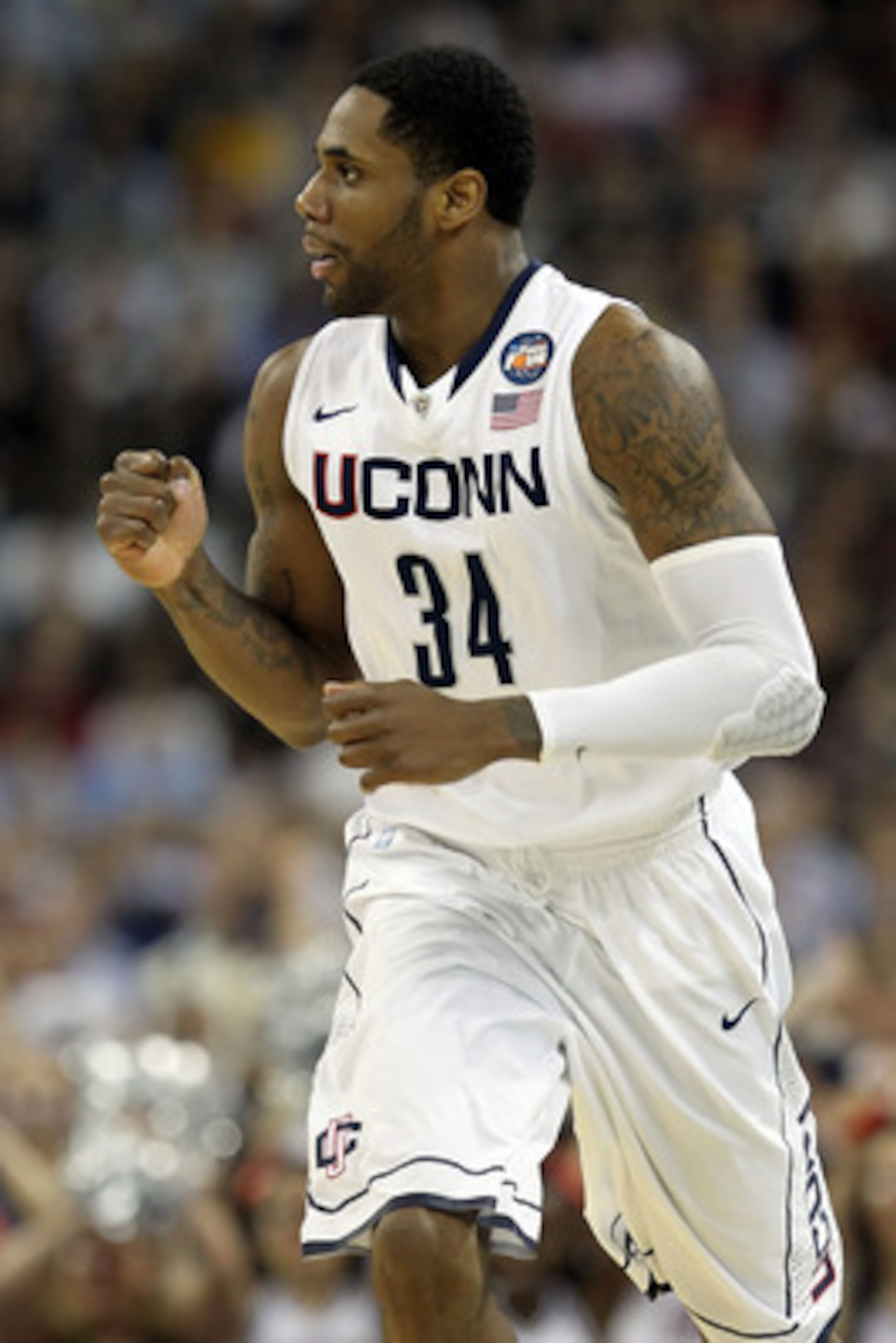 HOUSTON, TX - APRIL 04: Alex Oriakhi #34 of the Connecticut Huskies reacts after a dunk against the Butler Bulldogs during the National Championship Game of the 2011 NCAA Division I Men's Basketball Tournament at Reliant Stadium on April 4, 2011 in Houst HOUSTON, TX - APRIL 04: Alex Oriakhi #34 of the Connecticut Huskies reacts after a dunk against the Butler Bulldogs during the National Championship Game of the 2011 NCAA Division I Men's Basketball Tournament at Reliant Stadium on April 4, 2011 in Houst
