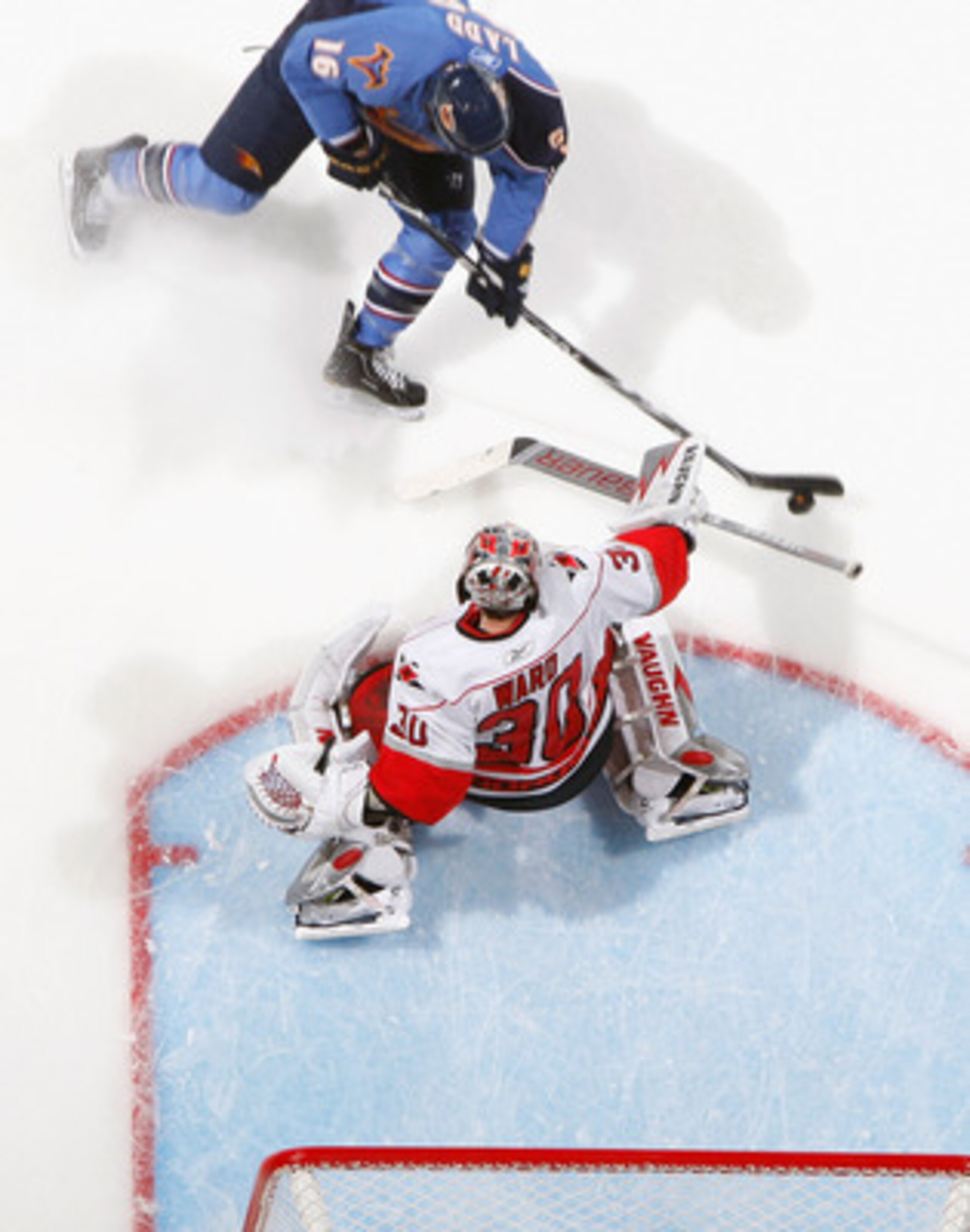 ATLANTA, GA - FEBRUARY 13:  Andrew Ladd #16 of the Atlanta Thrashers scores a goal past goaltender Cam Ward #30 of the Carolina Hurricanes at Philips Arena on February 13, 2011 in Atlanta, Georgia.  (Photo by Kevin C. Cox/Getty Images)