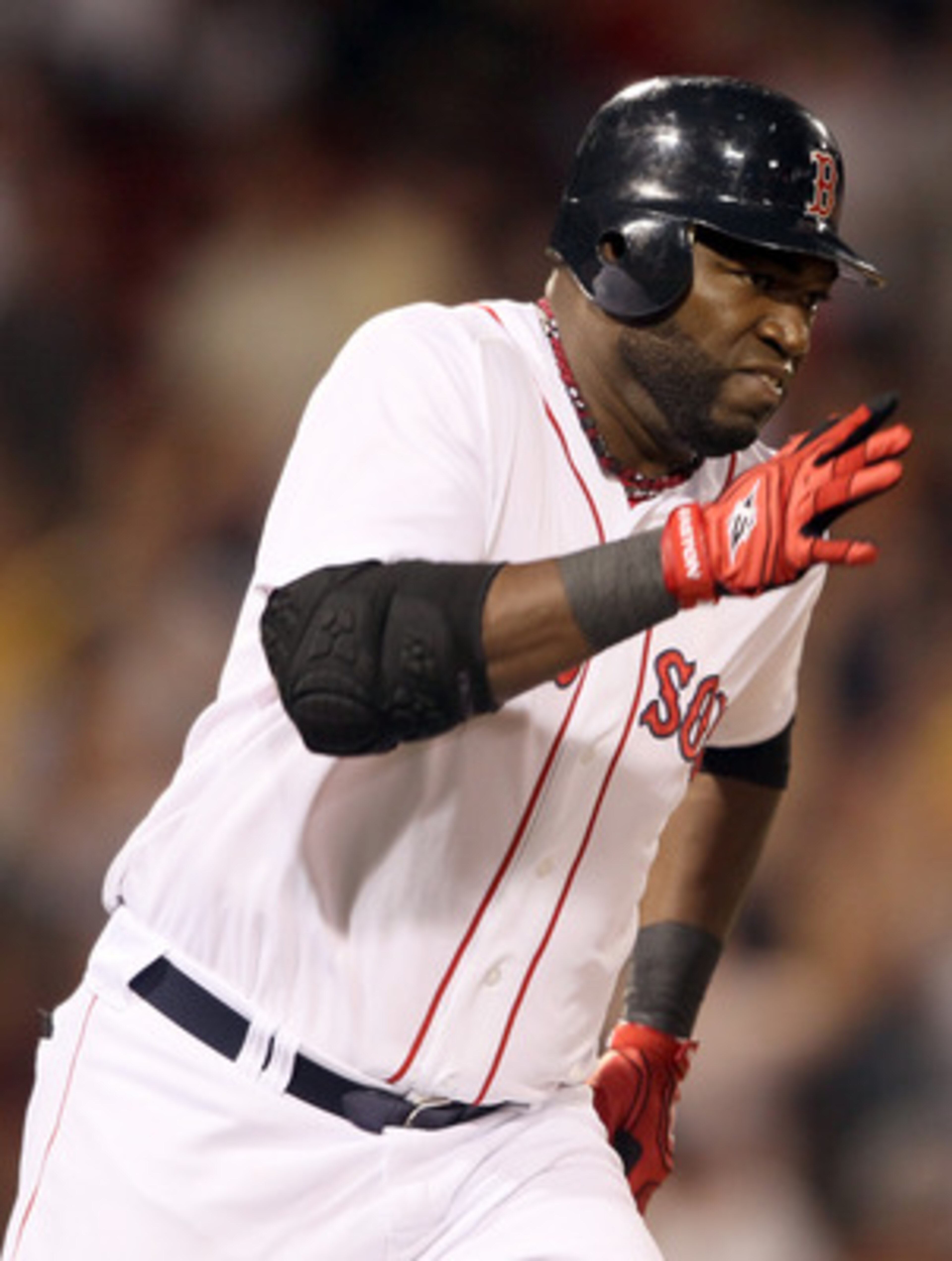 BOSTON, MA - MAY 31:  David Ortiz #34 of the Boston Red Sox heads around the bases after his three run homer in the eighth inning against the Chicago White Sox on May 31, 2011 at Fenway Park in Boston, Massachusetts.  (Photo by Elsa/Getty Images)
