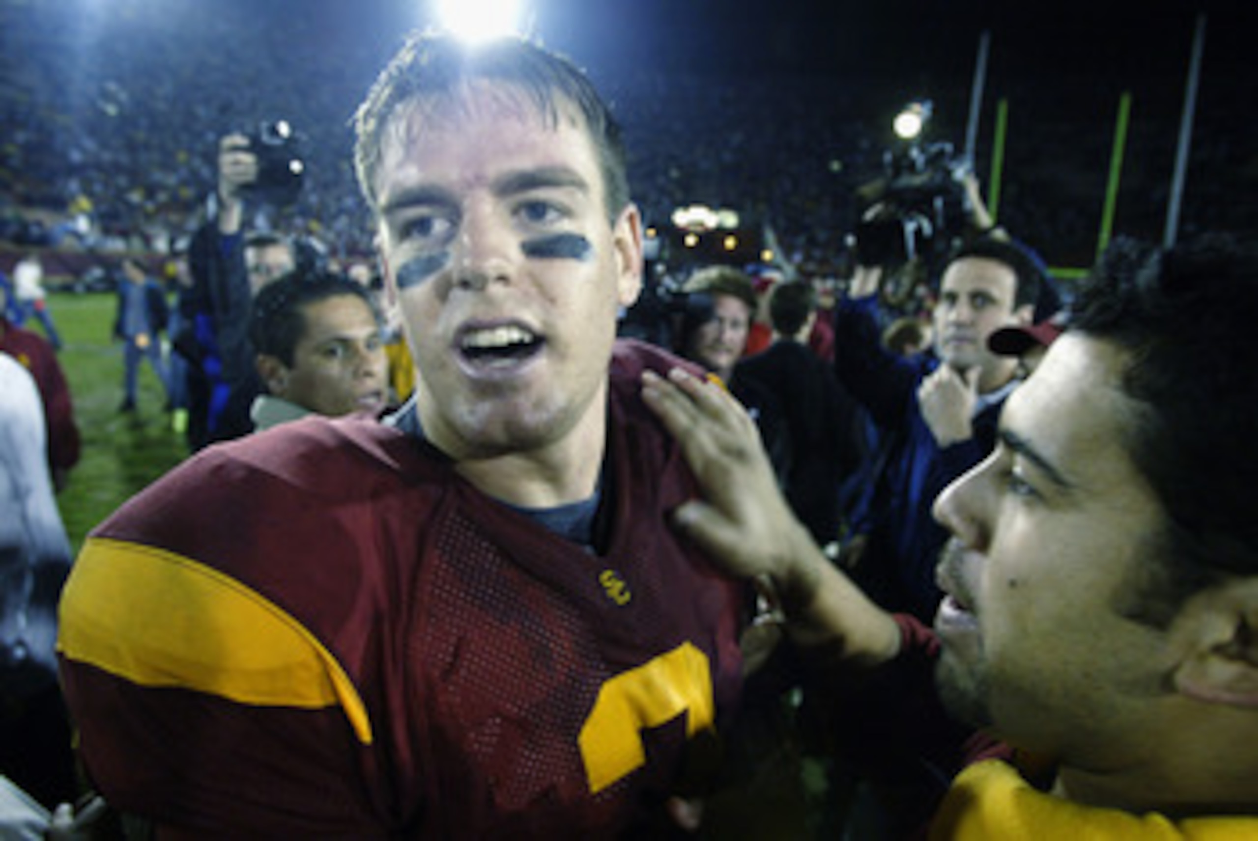 LOS ANGELES - NOVEMBER 30:  Quarterback Carson Palmer #3 of the University of Southern California Trojans celebrates after defeating the University of Notre Dame Fighting Irish at the Los Angeles Coliseum on November 30, 2002 in Los Angeles, California. T