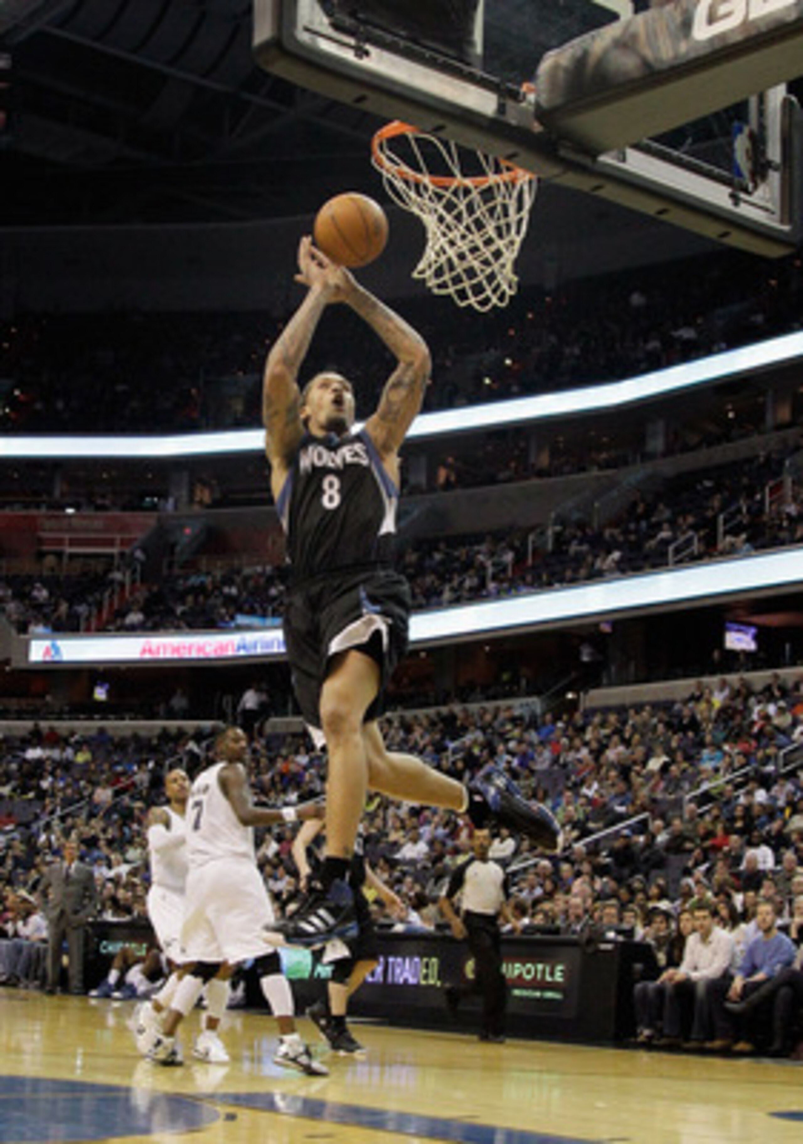 WASHINGTON, DC - MARCH 05:  Michael Beasley #8 of the Minnesota Timberwolves dunks against the Washington Wizards at the Verizon Center on March 5, 2011 in Washington, DC. NOTE TO USER: User expressly acknowledges and agrees that, by downloading and/or us