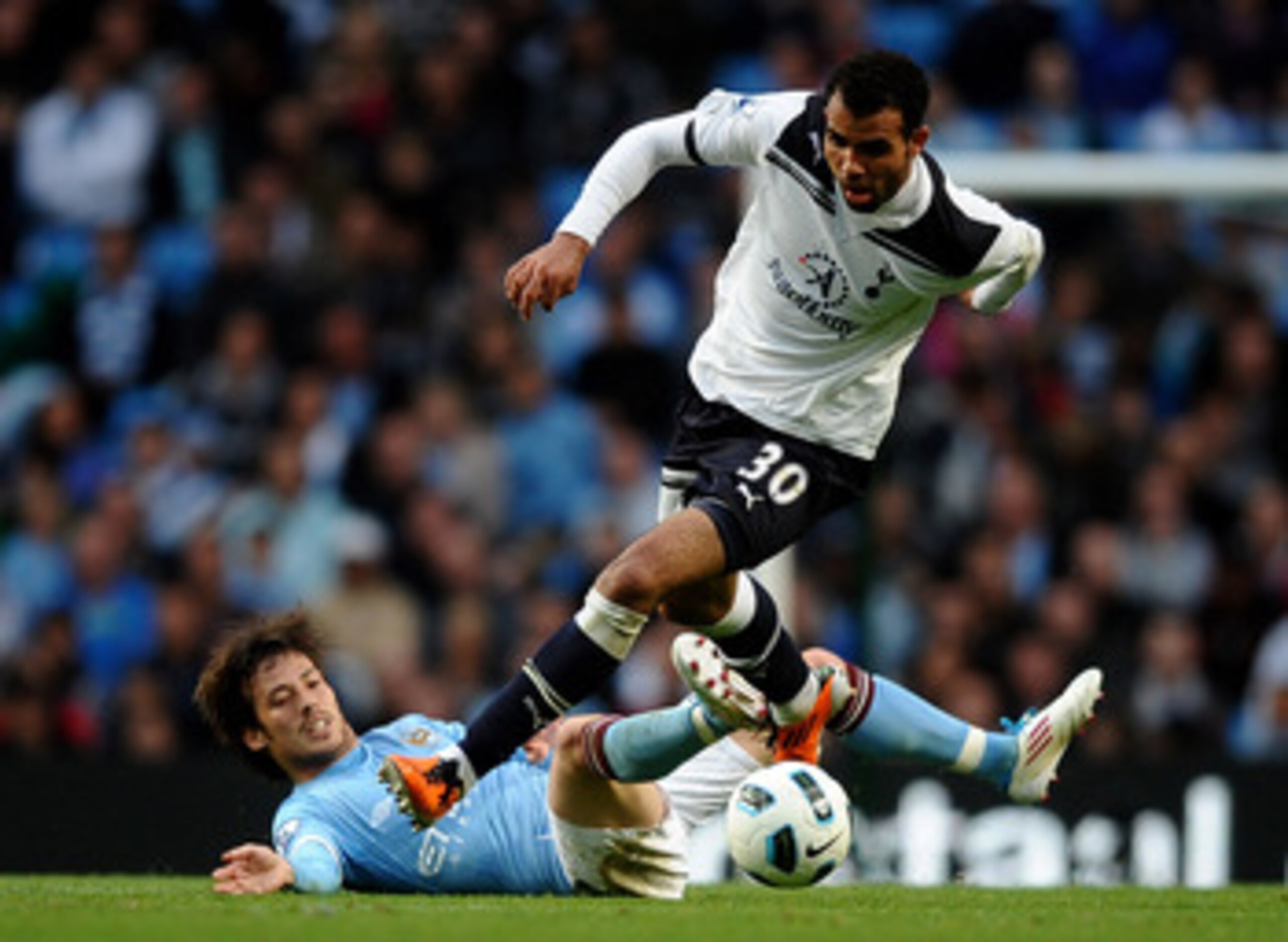 MANCHESTER, ENGLAND - MAY 10:  Sandro of Tottenham Hotspur competes with David Silva of Manchester City during the Barclays Premier League match between Manchester City and Tottenham Hotspur at the City of Manchester Stadium on May 10, 2011 in Manchester,
