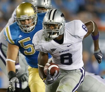 PASADENA, CA - SEPTEMBER 19:  Daniel Thomas #8 of the Kansas State Wildcats is pursued by Jess Ward #52 of the UCLA Bruins in the third quarter at the Rose Bowl on September 19, 2009 in Pasadena, California. UCLA defeated Kansas State 23-9.  (Photo by Jef