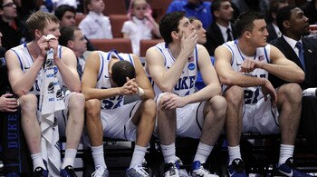 ANAHEIM, CA - MARCH 24:  Kyle Singler #12, Seth Curry #30, Ryan Kelly #34 and Miles Plumlee #21 of the Duke Blue Devils look on from the bench against the Arizona Wildcats during the west regional semifinal of the 2011 NCAA men's basketball tournament at 
