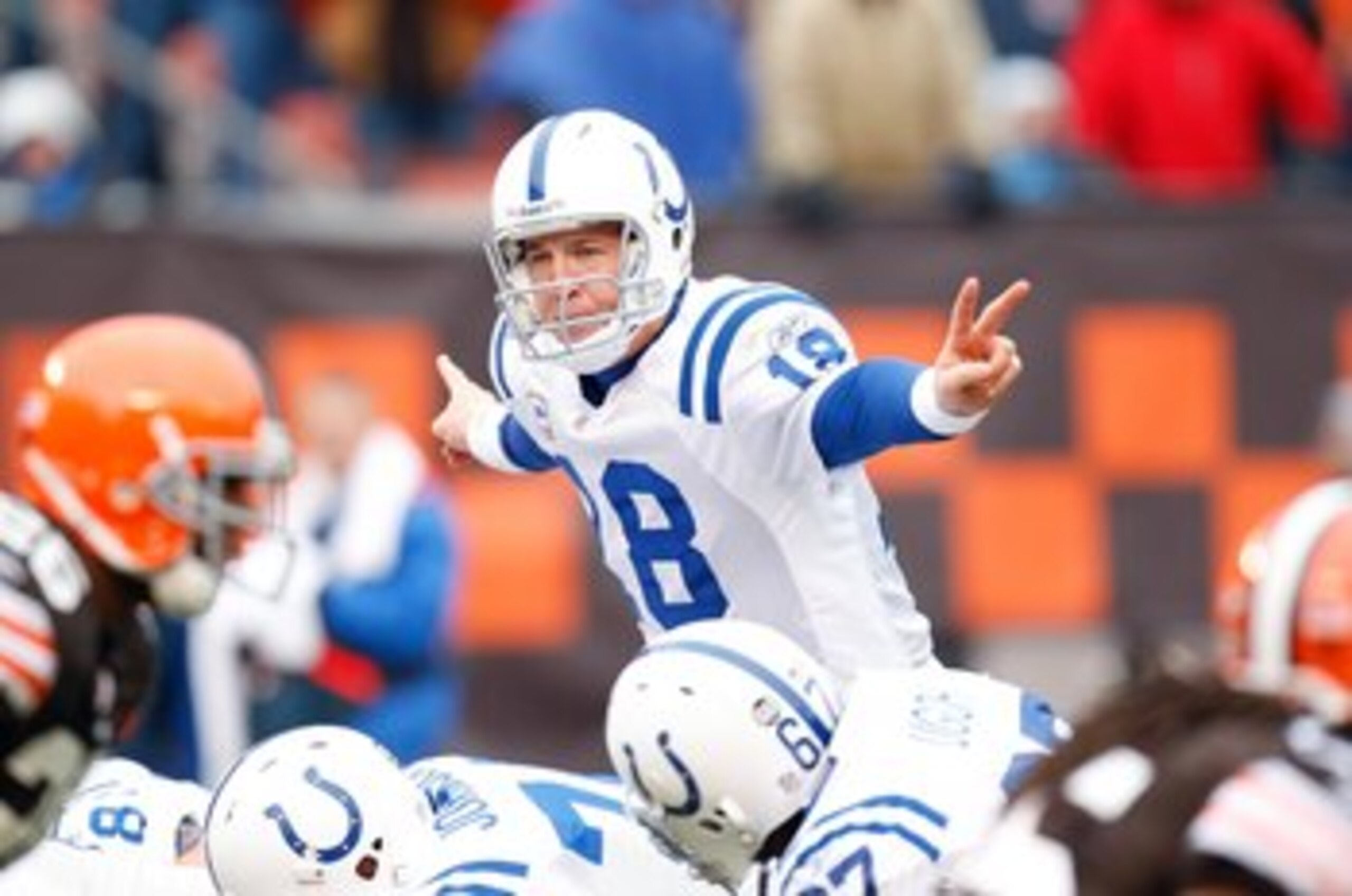 CLEVELAND - NOVEMBER 30:  Quarterback Peyton Manning #18 of the Indianapolis Colts signals a play at the line of scrimmage behind center during their NFL game against the Cleveland Browns on November 30, 2008 at Cleveland Browns Stadium in Cleveland, Ohio