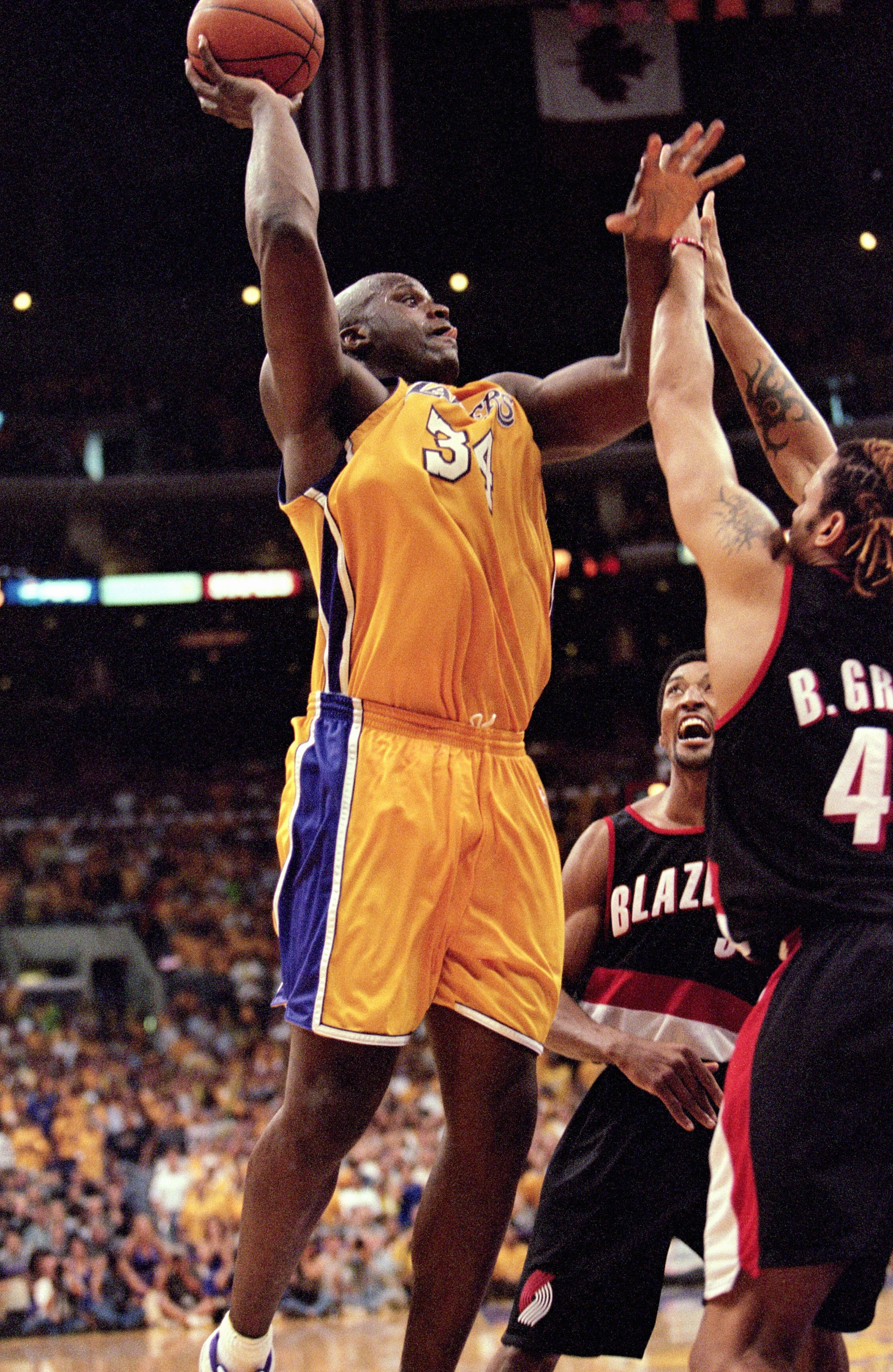 LOS ANGELES - JUNE 4:  Shaquille O'Neal #34 of the Los Angeles Lakers shoots over Brian Grant #44 of the Portland Trail Blazers during Game 7 of the Western Conference Finals at Staples Center on June 4, 2000 in Los Angeles, California. The Lakers won 98-