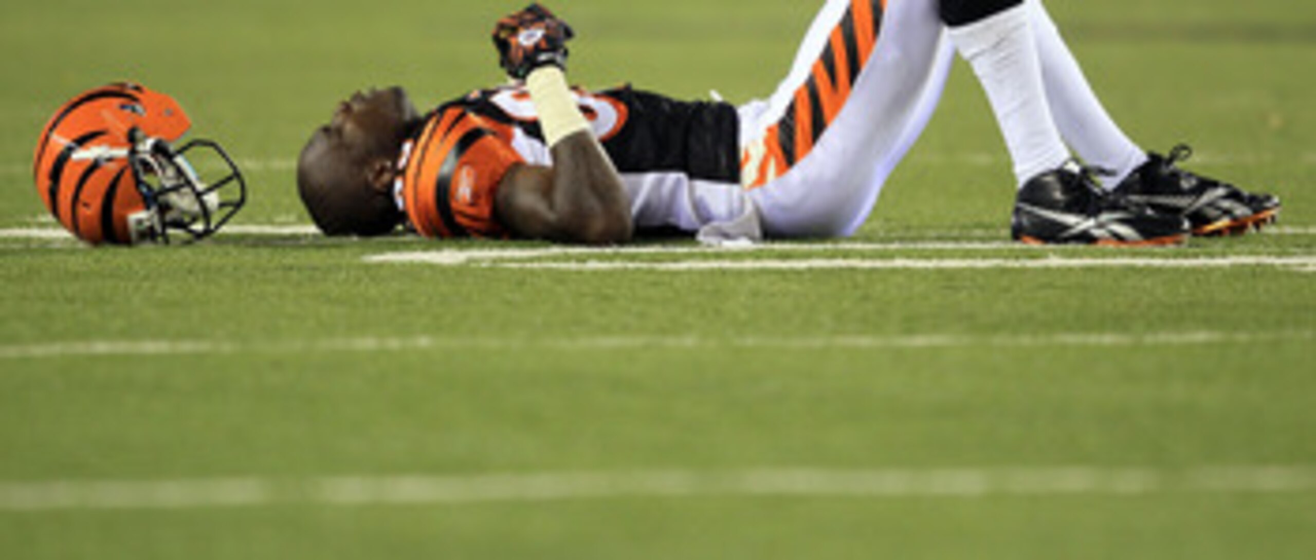 CINCINNATI - AUGUST 20:  Chad Ochocinco #85 of the Cincinnati Bengals lays on the field after being injured on a play during the NFL preseason game against the Philadelphia Eagles at Paul Brown Stadium on August 20, 2010 in Cincinnati, Ohio.  (Photo by An