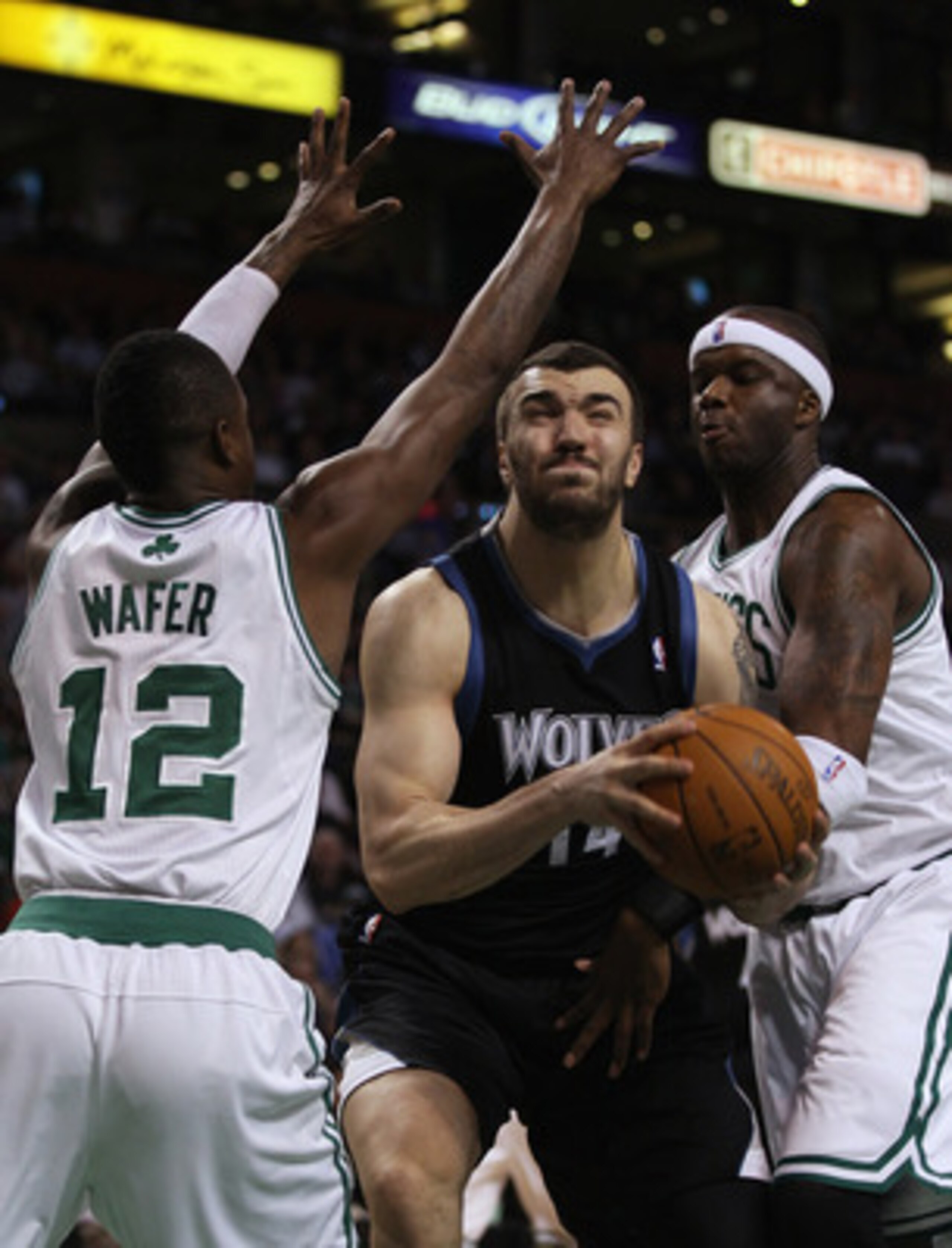 BOSTON, MA - JANUARY 03:  Nikola Pekovic #14 of the Minnesota Timberwolves tries to get between Von Wafer #12 and Jermaine O'Neal #7 of the Boston Celtics on January 3, 2011 at the TD Garden in Boston, Massachusetts. The Celtics defeated the Timberwolves