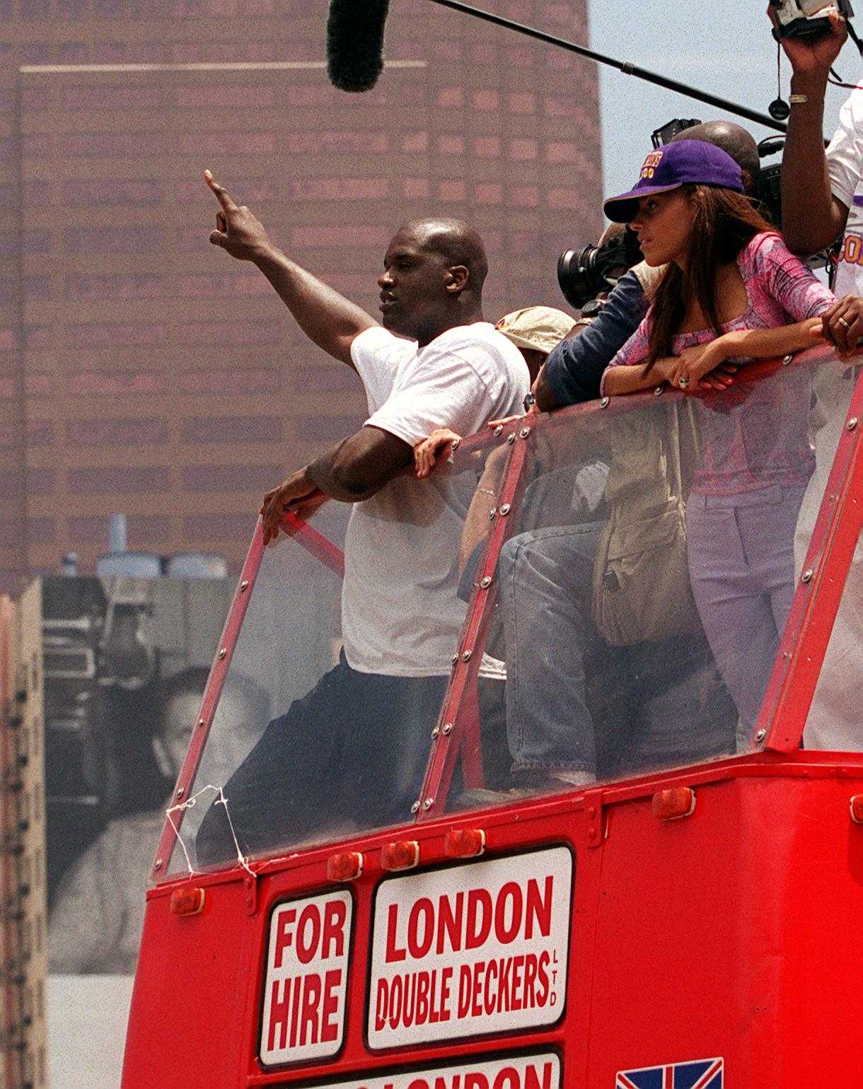371317 02: Shaquille O''Neal waves to fans during the Lakers parade and celebration outside the Staples Center June 21, 2000 in Los Angeles, CA. Over 250,000 fans attended the special event while 600 police officers were present to keep the crowd at bay. 