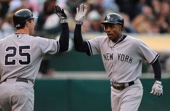 OAKLAND, CA - MAY 31:  Curtis Granderson #14 of the New York Yankees is congratulated by Mark Teixeira #25 of the New York Yankees after he hit a two run home run in the first inning against the Oakland Athletics at Oakland-Alameda County Coliseum on May