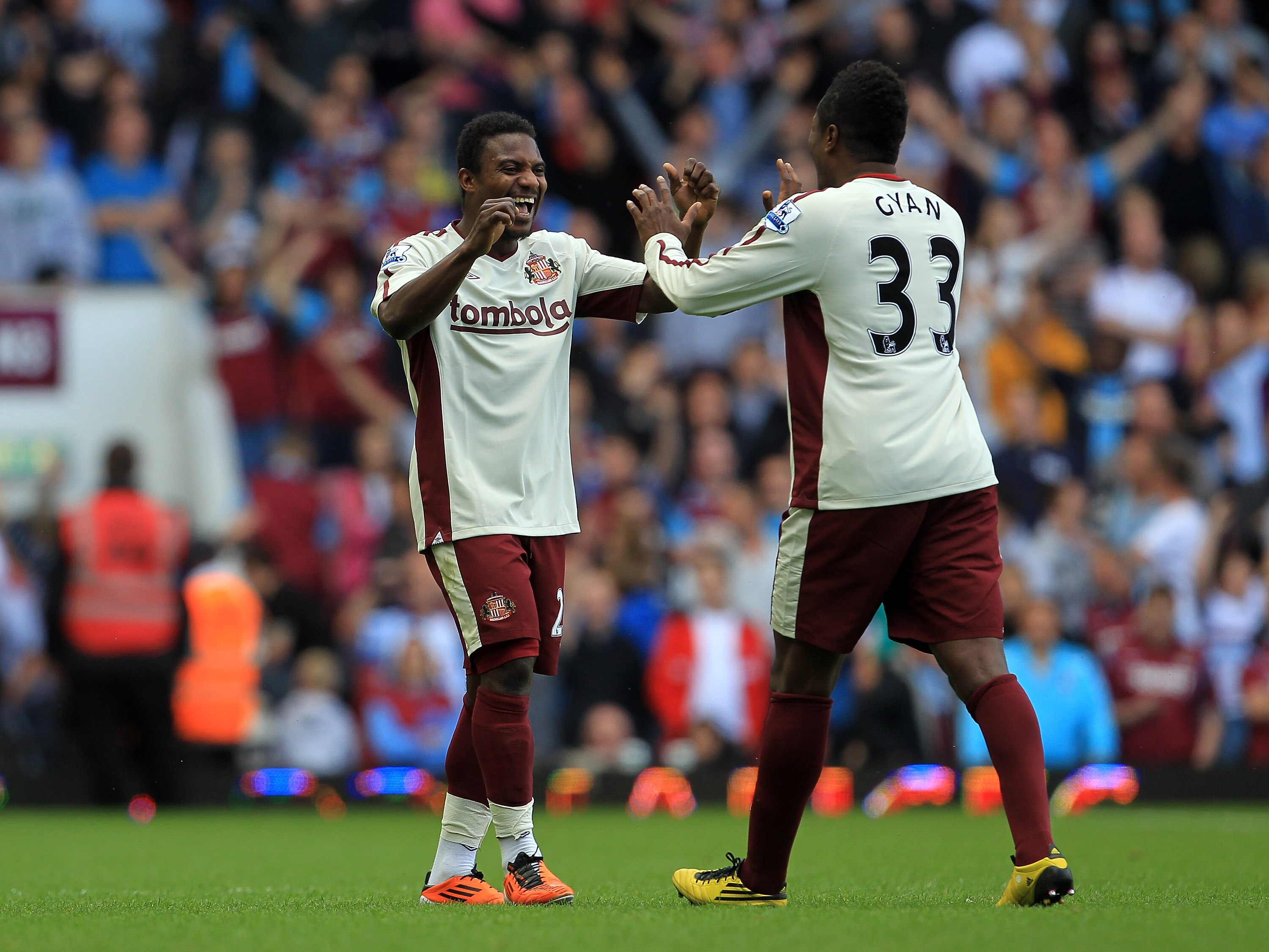LONDON, ENGLAND - MAY 22:  Stephane Sessegnon of Sunderland (left) celebrates scoring their second goal with Asamoah Gyan during the Barclays Premier League match between West Ham United and Sunderland at the Boleyn Ground on May 22, 2011 in London, Engla