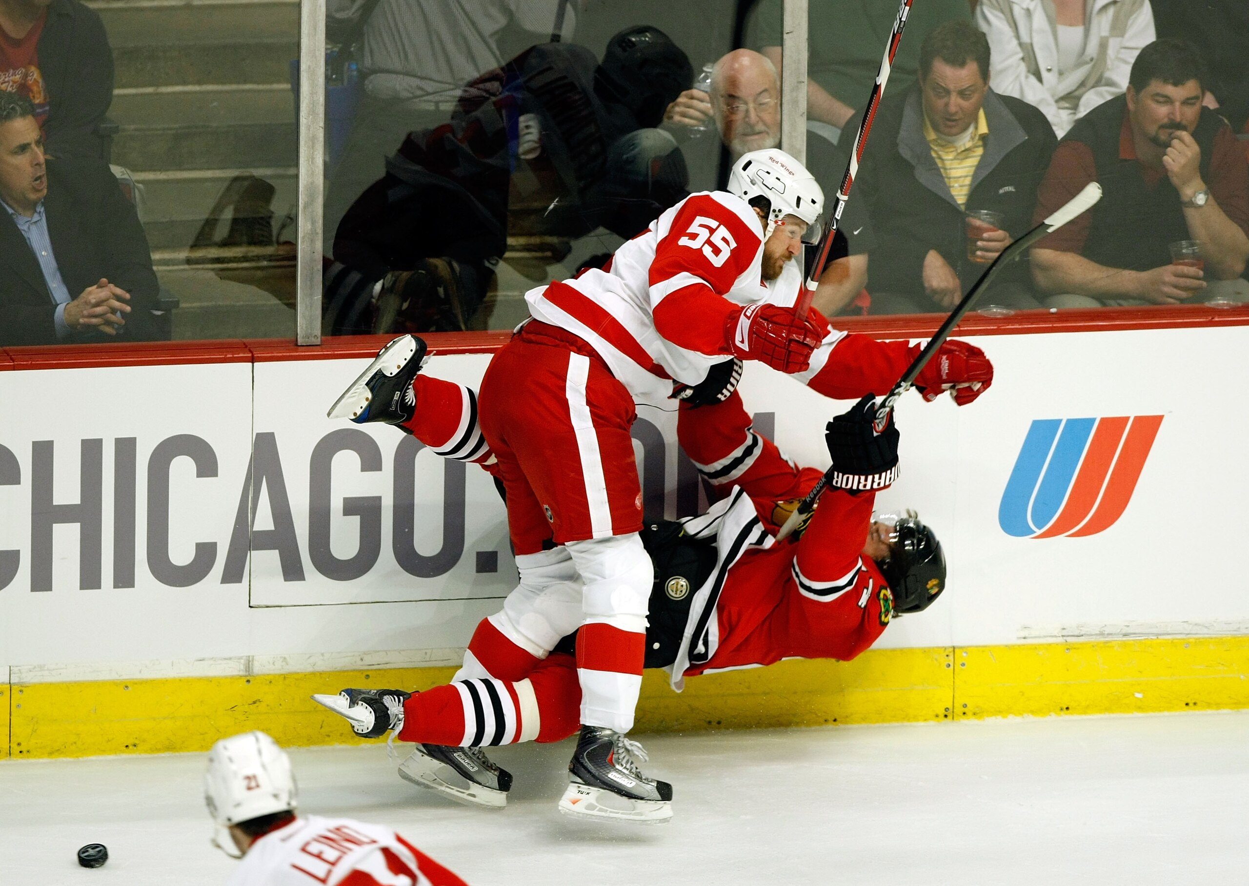 CHICAGO - MAY 22:  Martin Havlat #24 of the Chicago Blackhawks checked hard to the ice by Niklas Kronwall #55 of the Detroit Red Wings during the first period of Game Three of the Western Conference Championship Round of the 2009 Stanley Cup Playoffs on M
