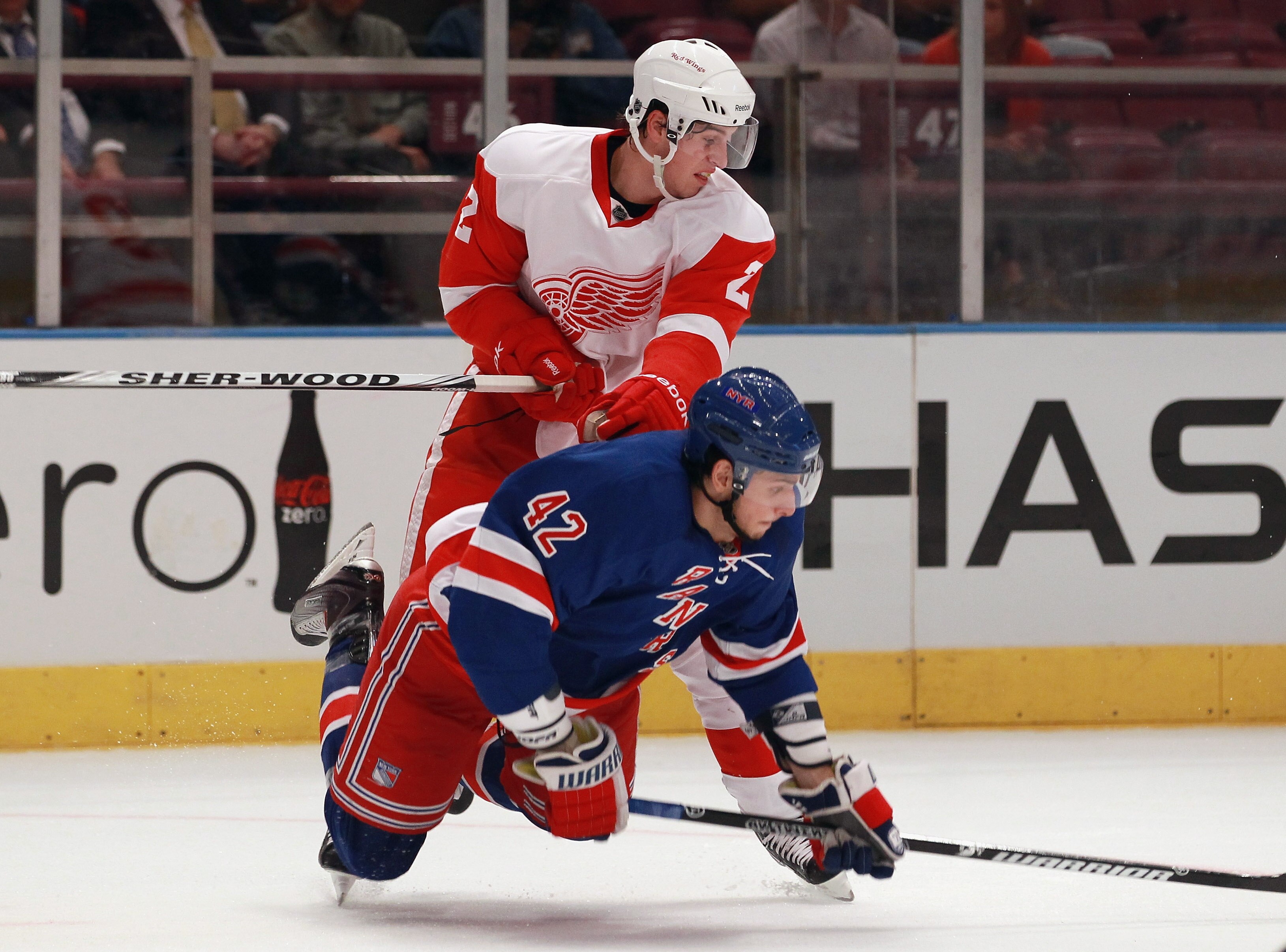 NEW YORK - SEPTEMBER 29: Brendan Smith #2 of the Detroit Red Wings hits Artem Anisimov #42 of the New York Rangers at Madison Square Garden on September 29, 2010 in New York City. (Photo by Bruce Bennett/Getty Images)