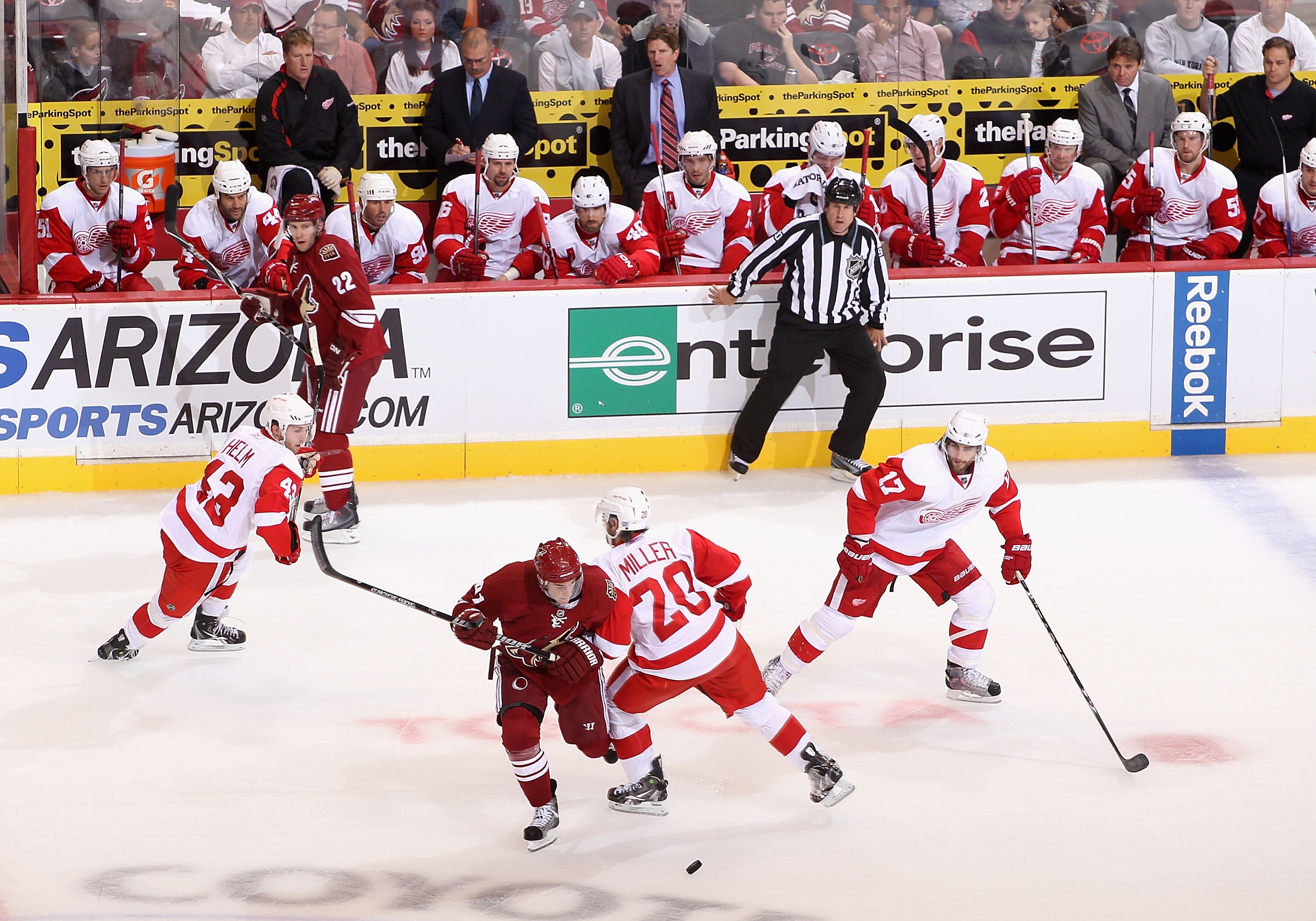 GLENDALE, AZ - OCTOBER 16:   Kyle Turris #91 of the Phoenix Coyotes attempts to skate with the puck past Drew Miller #20  of the Detroit Red Wings during the NHL game at Jobing.com Arena on October16, 2010 in Glendale, Arizona. The Red Wings defeated the