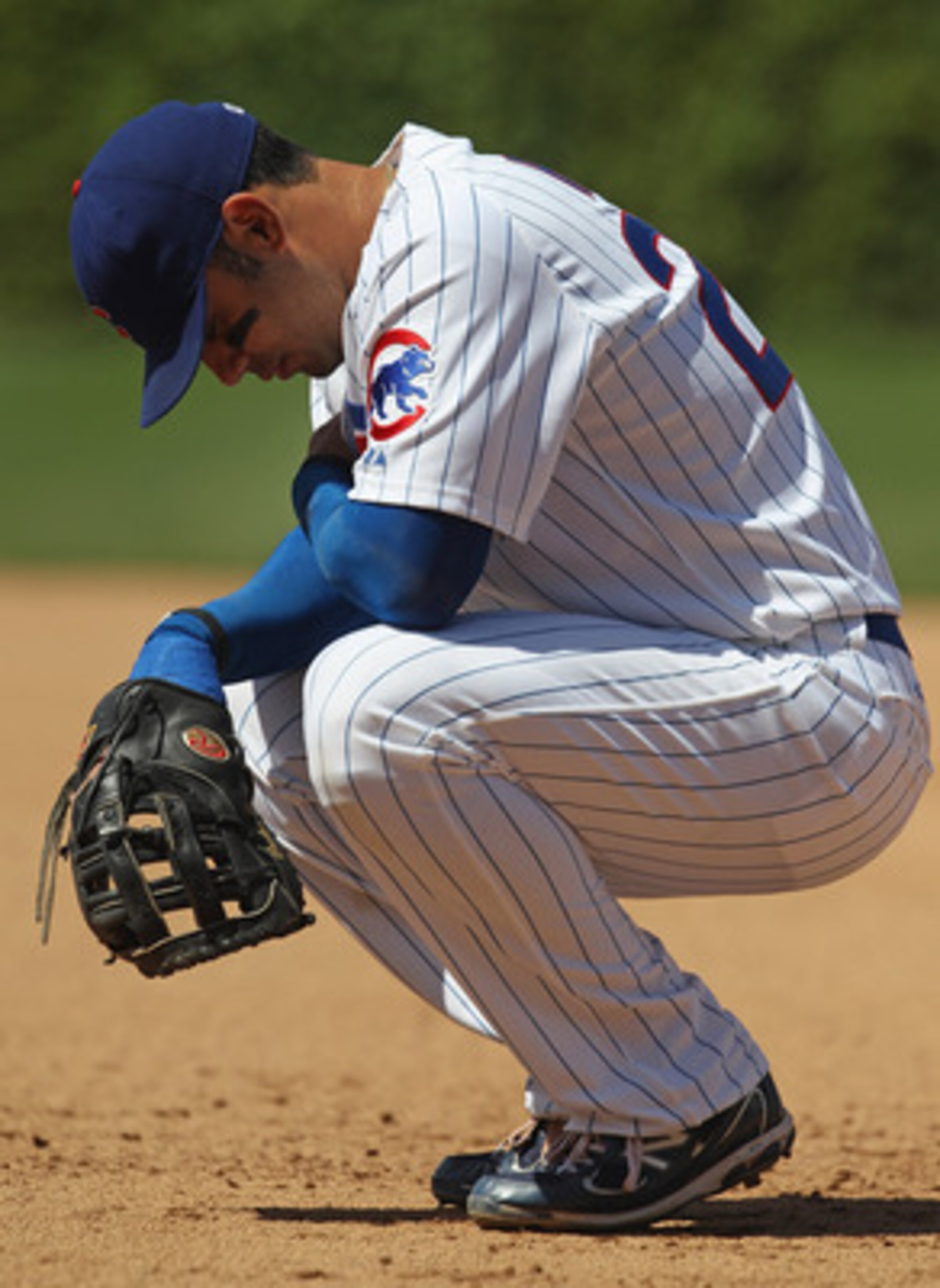CHICAGO, IL - MAY 27: Carlos Pena #22 of the Chicago Cubs waits for a mound visit during a game against the Pittsburgh Pirates at Wrigley Field on May 27, 2011 in Chicago, Illinois. The Pirates defeated the Cubs 4-2. (Photo by Jonathan Daniel/Getty Images