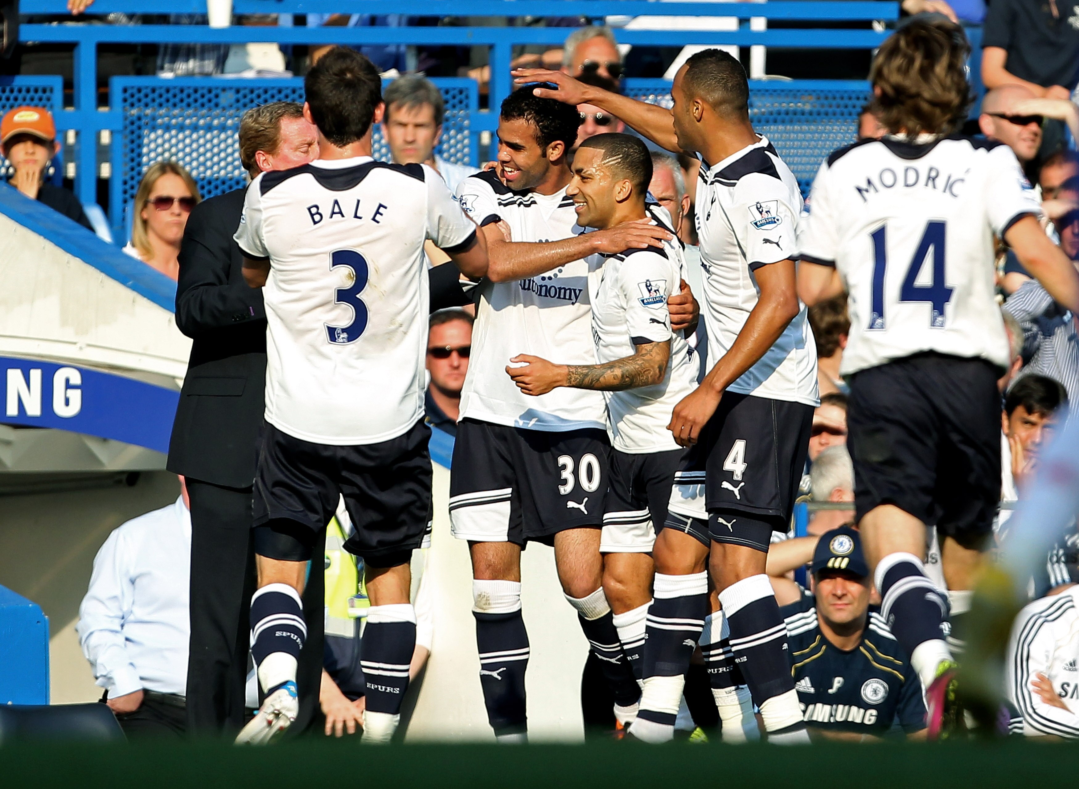 LONDON, ENGLAND - APRIL 30:  Sandro #30 of Spurs celebrates with teammates and manager Harry Redknapp after scoring the opening goal during the Barclays Premier League match between Chelsea and Tottenham Hotspur at Stamford Bridge on April 30, 2011 in Lon