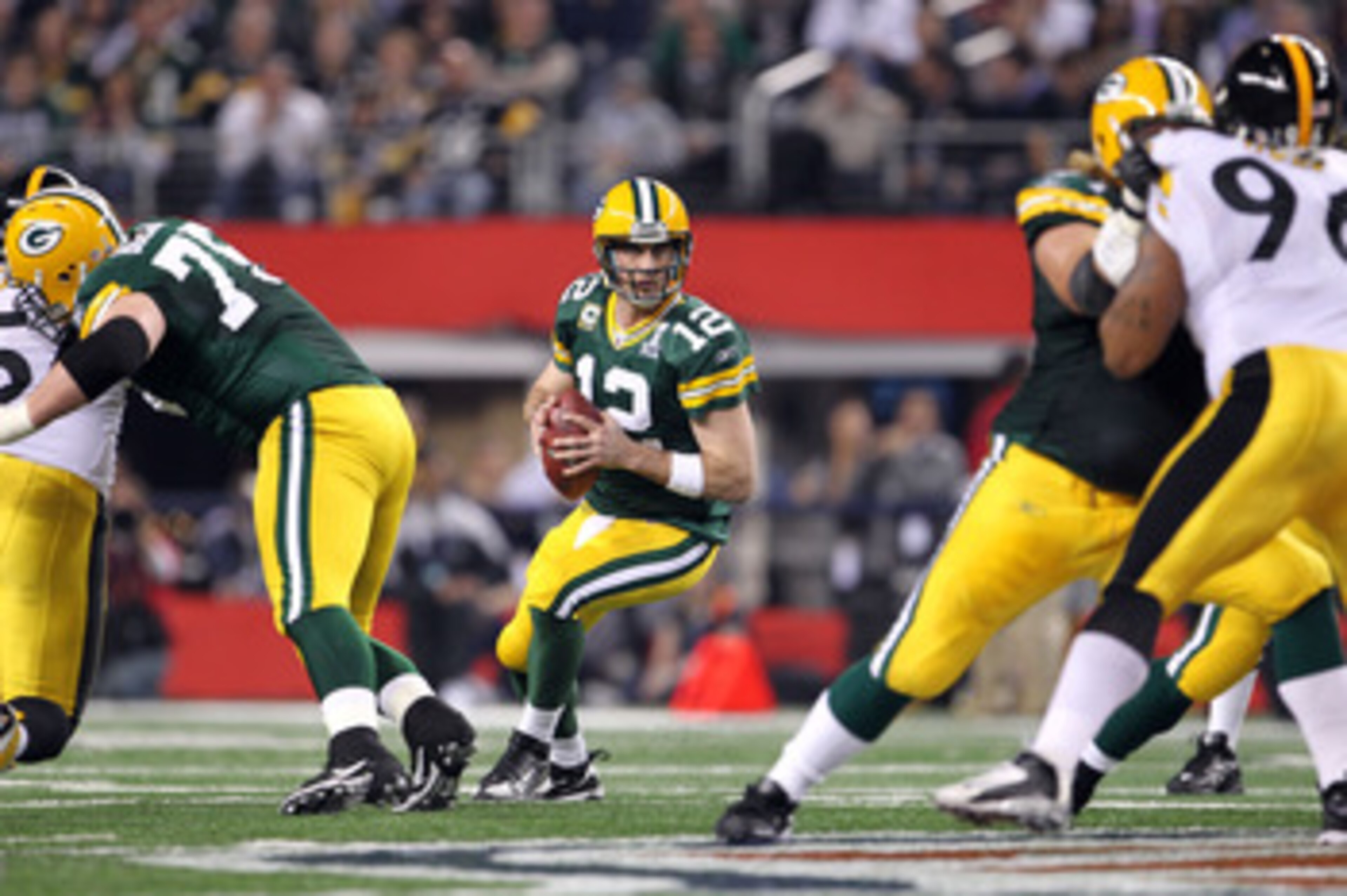 ARLINGTON, TX - FEBRUARY 06:  Aaron Rodgers #12 of the Green Bay Packers looks to pass against the Pittsburgh Steelers during Super Bowl XLV at Cowboys Stadium on February 6, 2011 in Arlington, Texas. The Packers won 31-25.  (Photo by Jamie Squire/Getty I