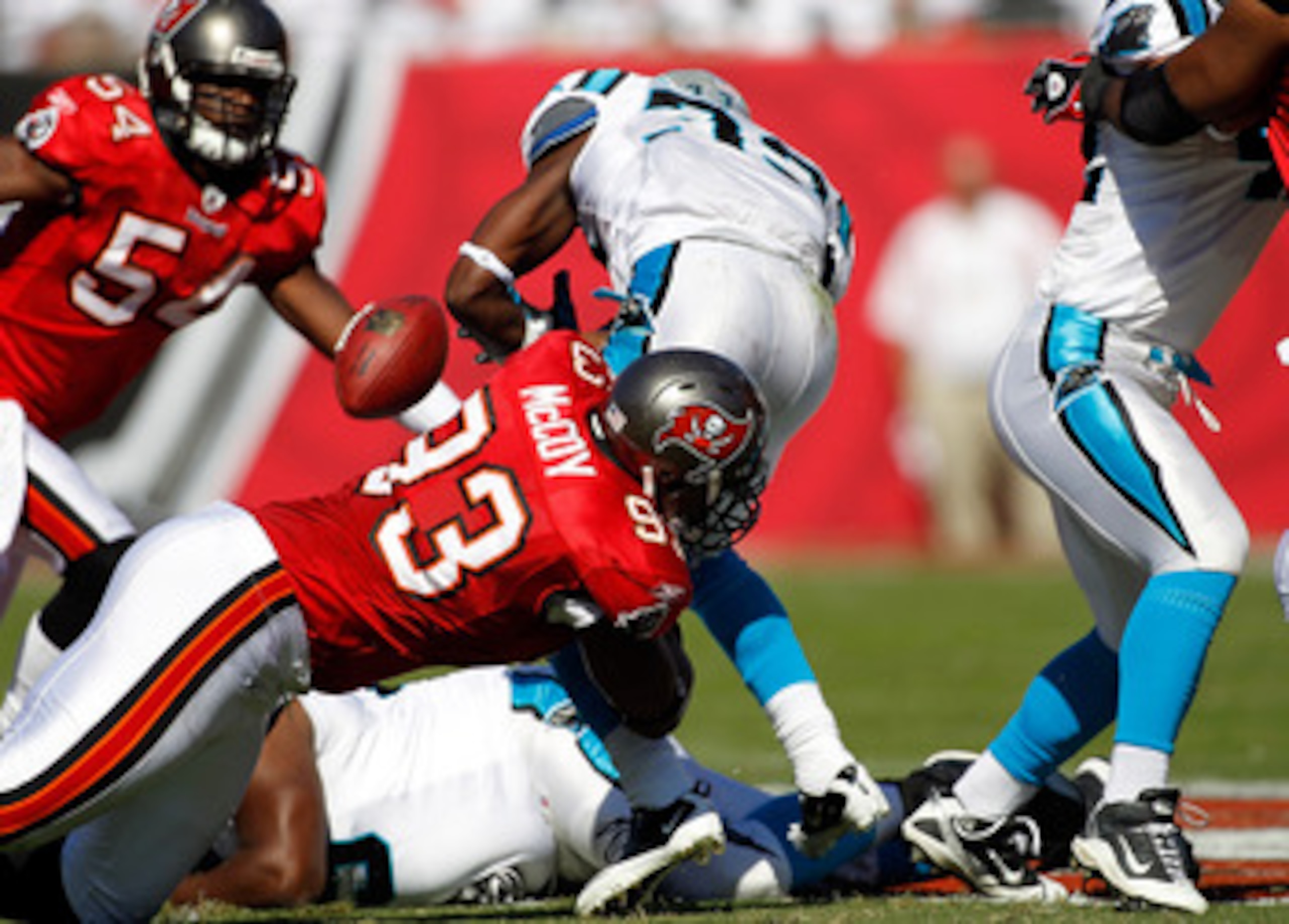 TAMPA, FL - NOVEMBER 14: Defensive tackle Gerald McCoy #93 of the Tampa Bay Buccaneers causes running back Mike Goodson #33 of the Carolina Panthers to fumble during the game at Raymond James Stadium on November 14, 2010 in Tampa, Florida. (Photo by J. TAMPA, FL - NOVEMBER 14: Defensive tackle Gerald McCoy #93 of the Tampa Bay Buccaneers causes running back Mike Goodson #33 of the Carolina Panthers to fumble during the game at Raymond James Stadium on November 14, 2010 in Tampa, Florida. (Photo by J.