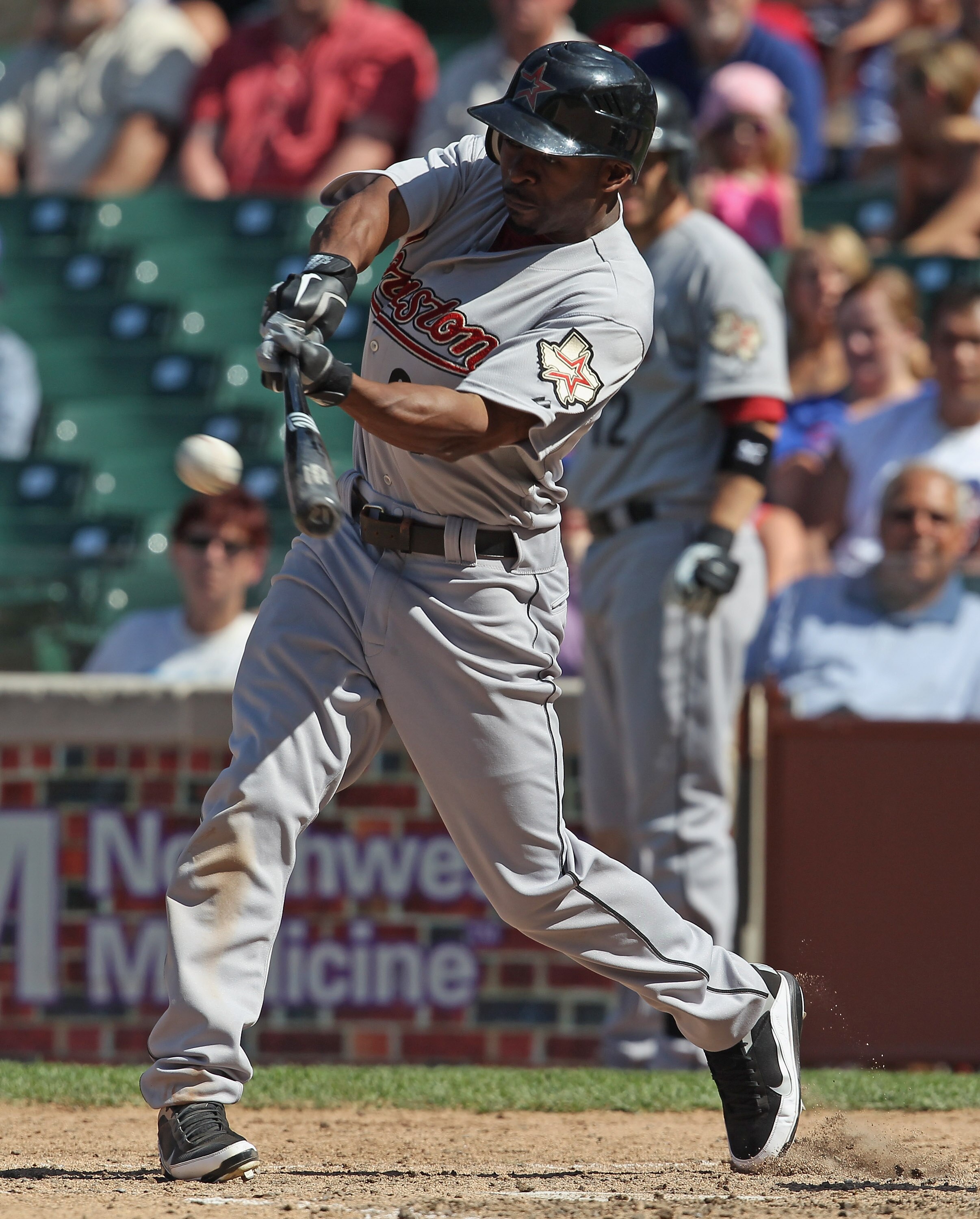 CHICAGO, IL - JUNE 01:  Michael Bourn #21 of the Houston Astros hits the ball against the Chicago Cubs at Wrigley Field on June 1, 2011 in Chicago, Illinois. The Astros defeated the Cubs 3-1.  (Photo by Jonathan Daniel/Getty Images)
