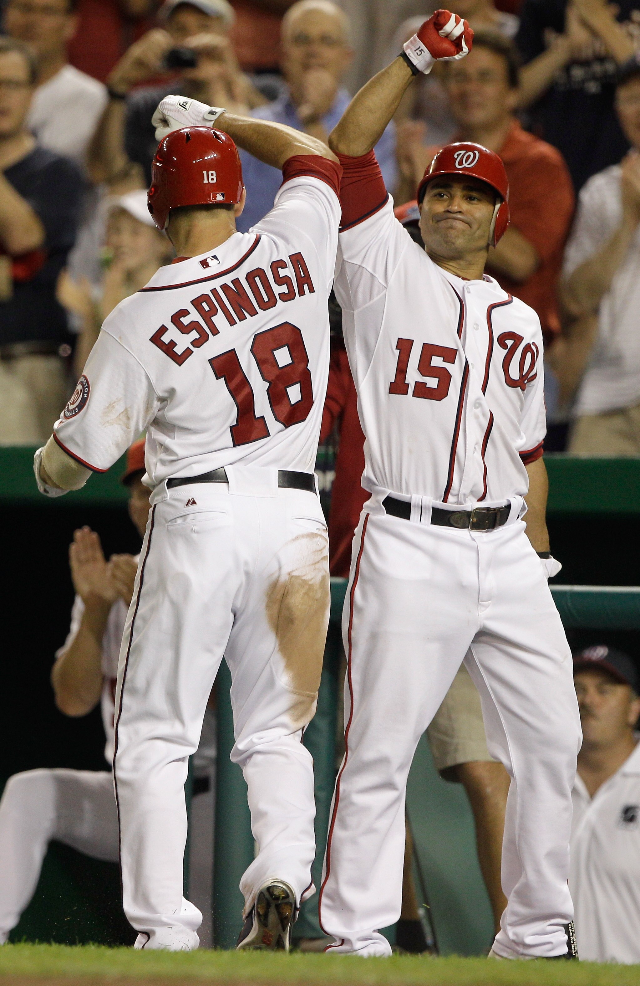 WASHINGTON, DC - MAY 31: Danny Espinosa #18 of the Washington Nationals celebrates his solo home run with teammate Jerry Hairston Jr. #15 during the sixth inning against the Philadelphia Phillies at Nationals Park on May 31, 2011 in Washington, DC.  (Phot