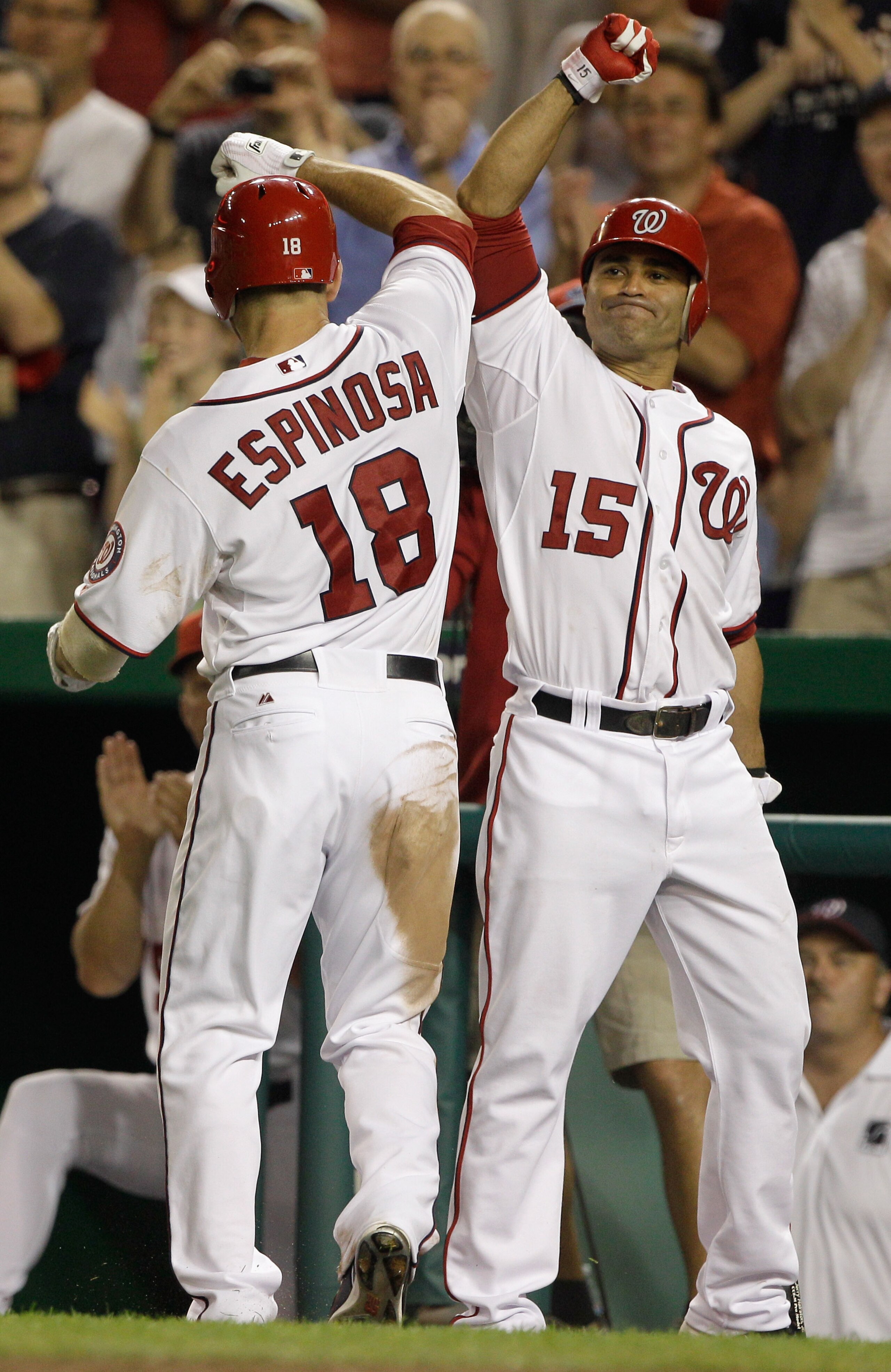WASHINGTON, DC - MAY 31: Danny Espinosa #18 of the Washington Nationals celebrates his solo home run with teammate Jerry Hairston Jr. #15 during the sixth inning against the Philadelphia Phillies at Nationals Park on May 31, 2011 in Washington, DC.  (Phot