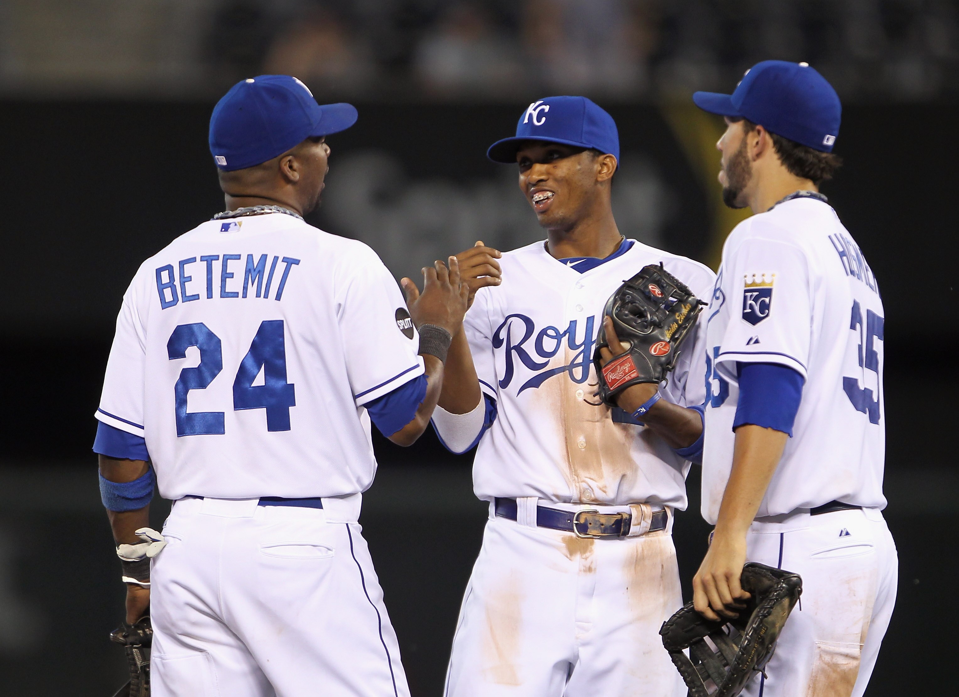KANSAS CITY, MO - MAY 31:  Alcides Escobar #2 of the Kansas City Royals is congratulates Wilson Betemit #24 and Eric Hosmer #35 after the Royals defeated the Los Angeles Angels of Anaheim on May 31, 2011 at Kauffman Stadium in Kansas City, Missouri.  (Pho