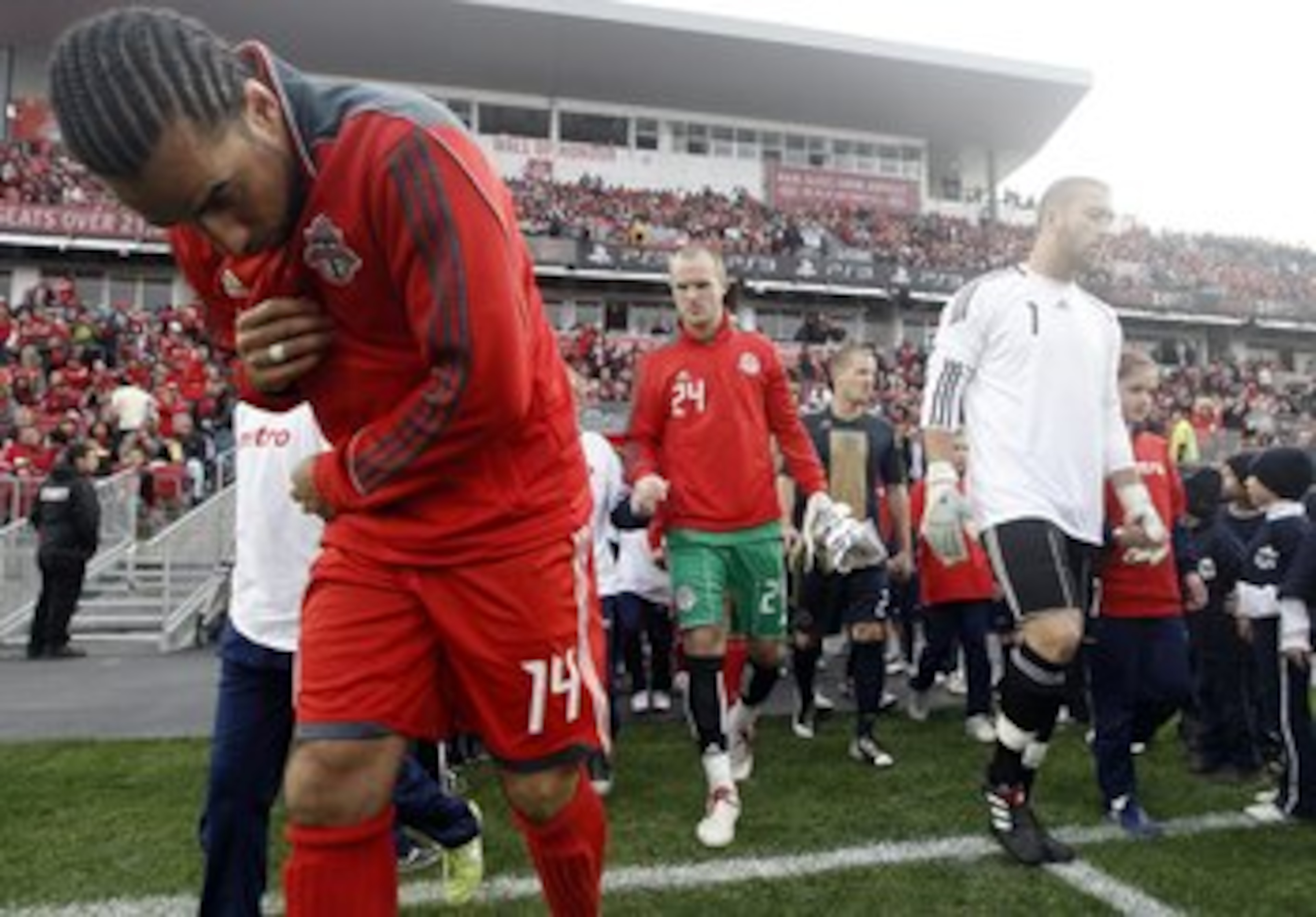 TORONTO - APRIL 15: Newly named captain Dwayne DeRosario #14 of Toronto FC takes to the new grass fiels before playing Philadelphia Union during action at BMO Field April 15, 2010 in Toronto, Ontario, Canada. (Photo by Abelimages/Getty Images)