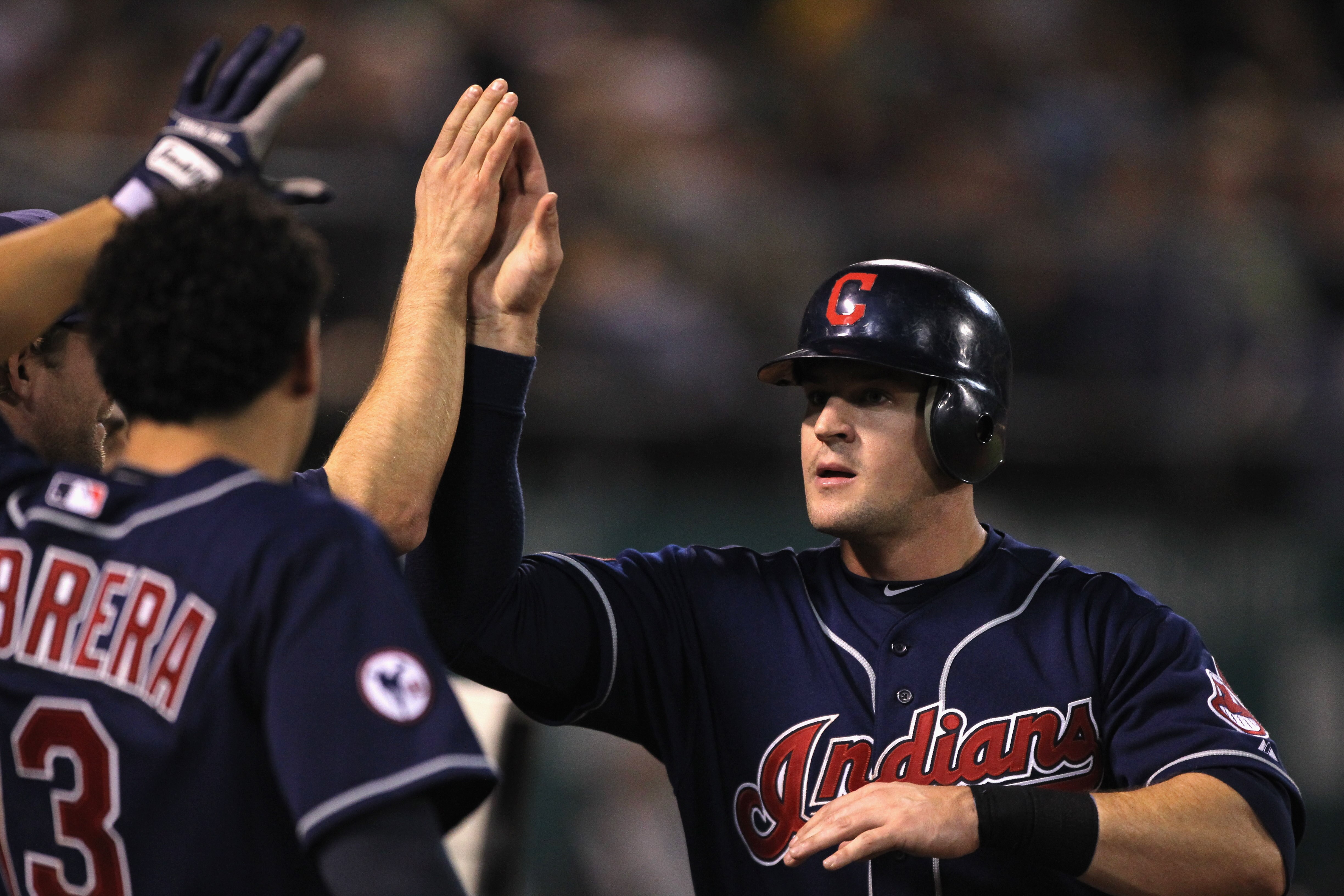 OAKLAND, CA - MAY 03:  Matt LaPorta #7 of the Cleveland Indians is congratulated by teammates after he scored the go ahead run in the ninth inning against the Oakland Athletics at Oakland-Alameda County Coliseum on May 3, 2011 in Oakland, California.  (Ph