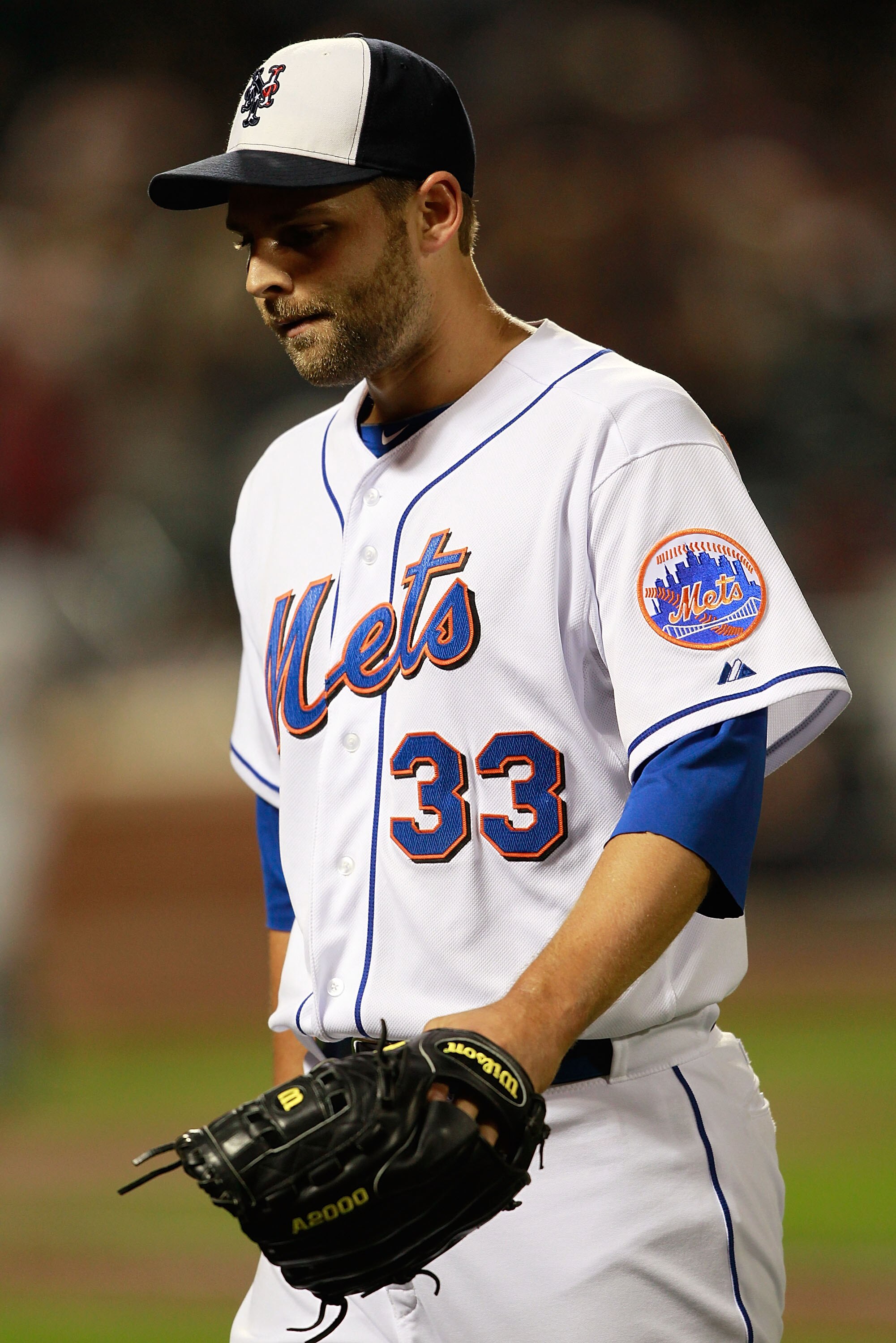 NEW YORK, NY - MAY 03:  Taylor Buchholz #33 of the New York Mets walks to the dugout in the 10th inning against the San Francisco Giants at Citi Field on May 3, 2011 in the Flushing neighborhood of the Queens borough of New York City.  (Photo by Chris Tro