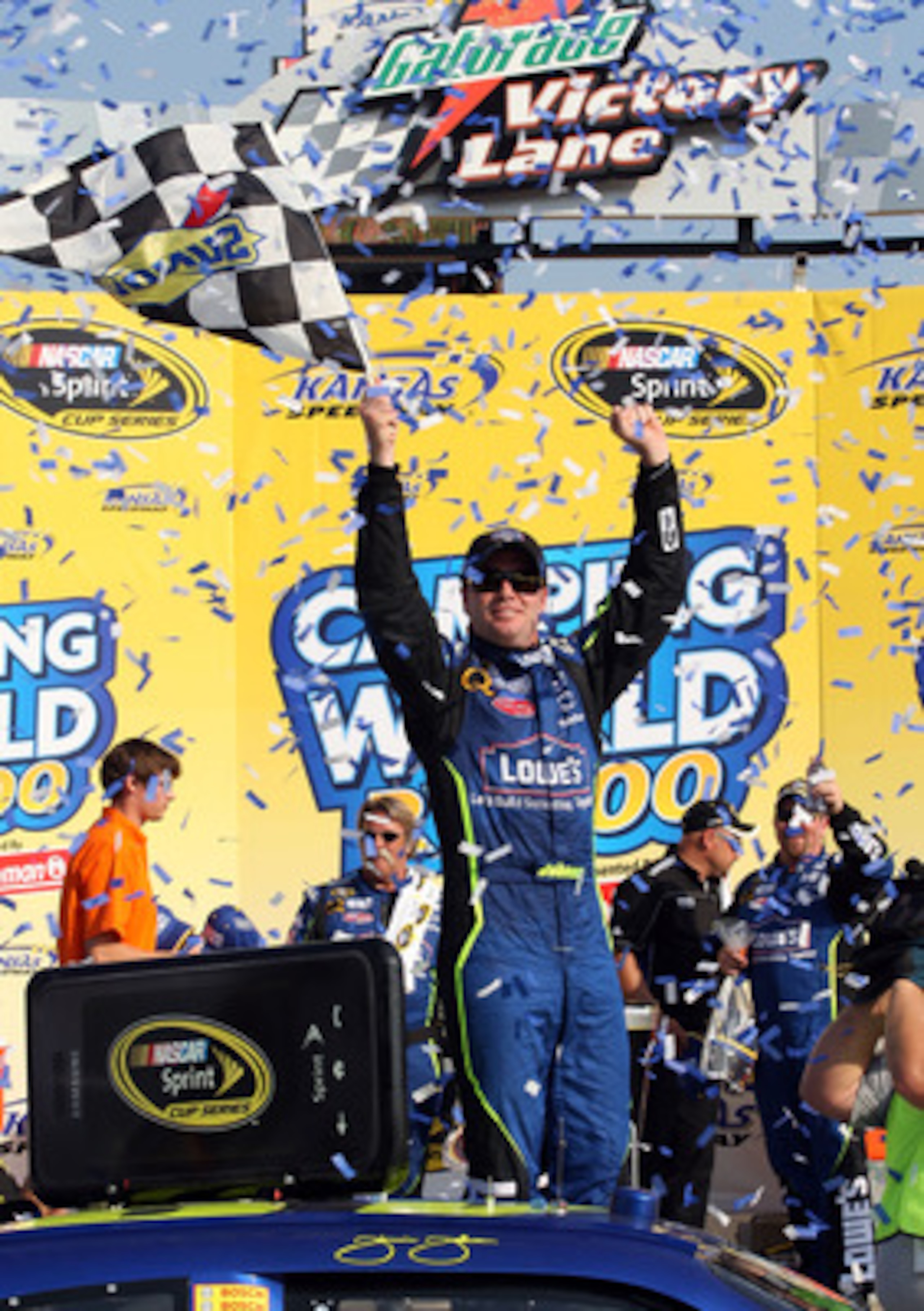 KANSAS CITY, KS - SEPTEMBER 28: Jimmie Johnson, driver of the #48 Lowe's Chevrolet, celebrates in victory lane after winning the NASCAR Sprint Cup Series Camping World RV 400 at Kansas Speedway on September 28, 2008 in Kansas City, Kansas.  (Photo by John
