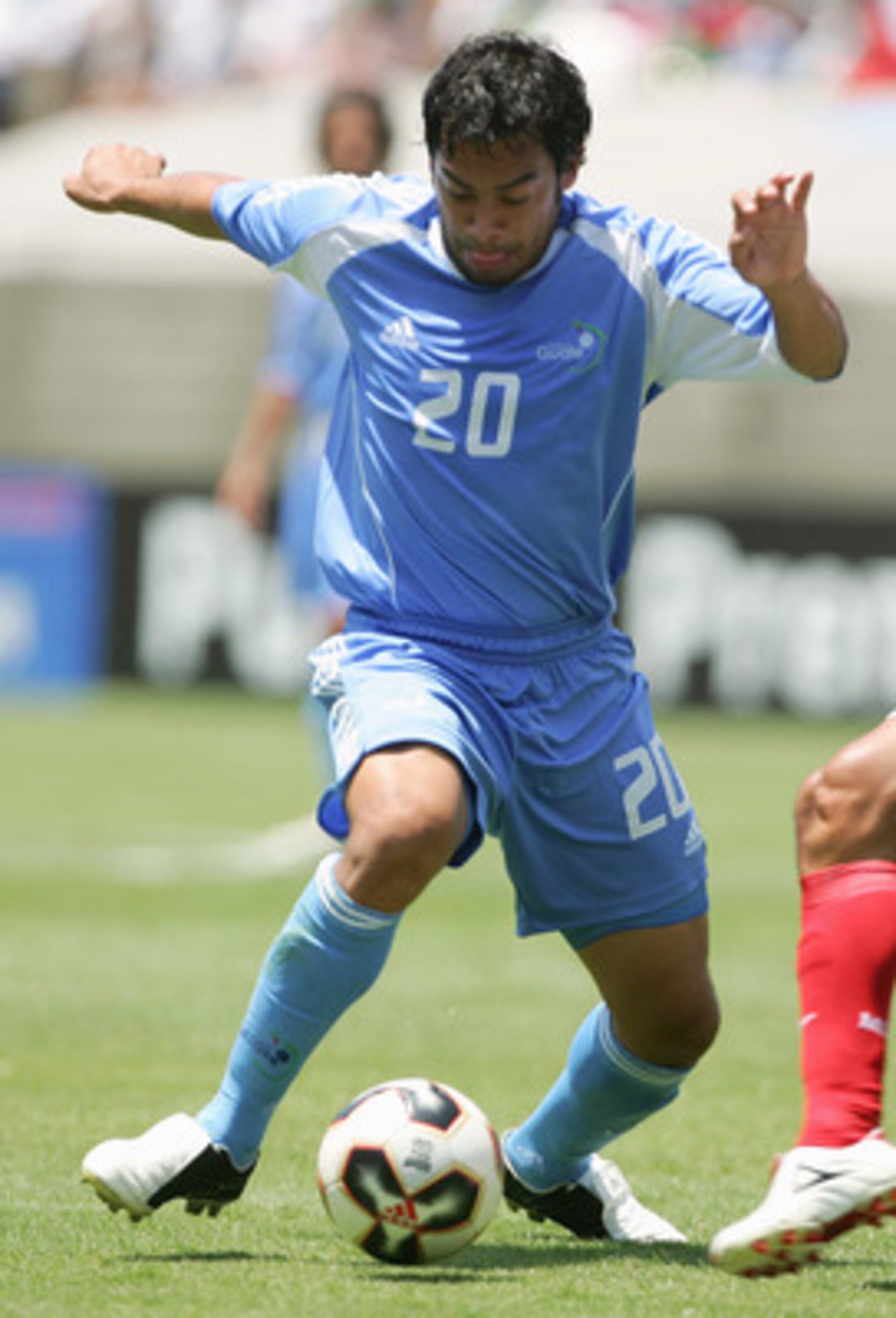 LOS ANGELES - JULY 10:  Carlos Arnaldo Salcido #3 of Mexico challenges Carlos Ruiz #20 of Guatemala for the ball during the CONCACAF Gold Cup 2005 at the Los Angeles Coliseum on July 10, 2005 in Los Angeles, California. Mexico won 4-0. (Photo by Harry How