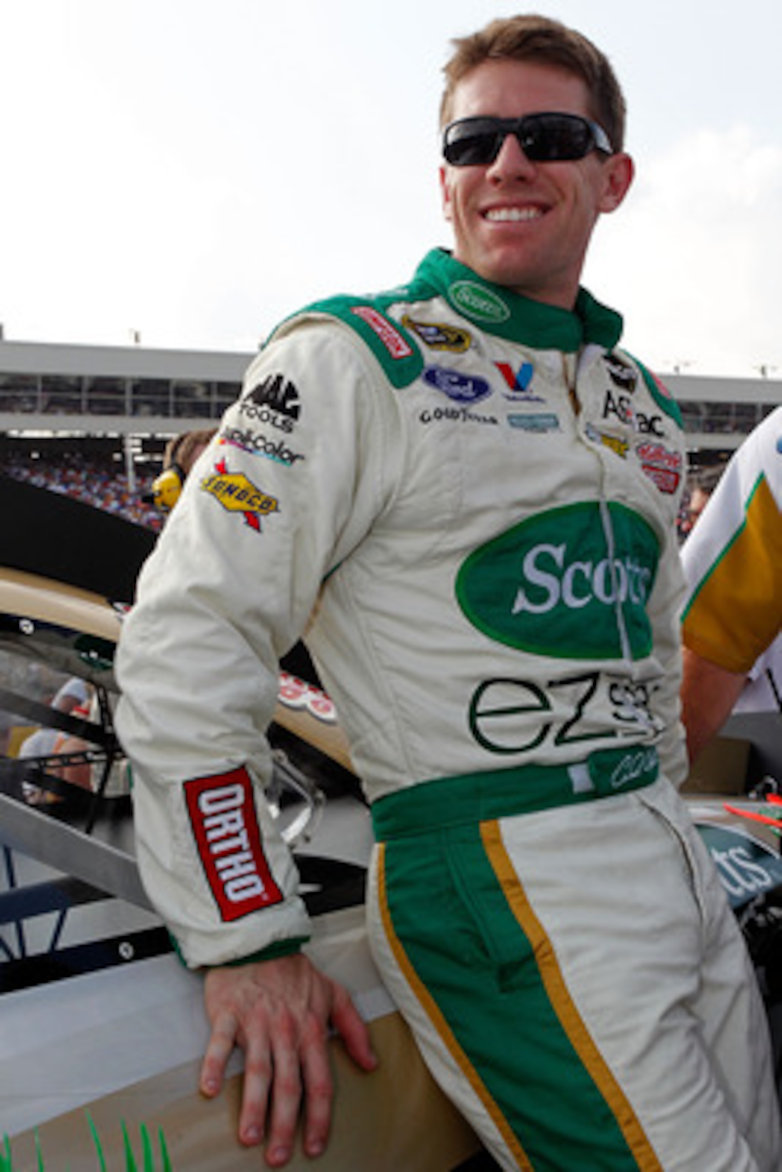 CONCORD, NC - MAY 29: Carl Edwards, driver of the #99 Scotts EZ Seed Ford, stands by his car on the grid prior to the NASCAR Sprint Cup Series Coca-Cola 600 at Charlotte Motor Speedway on May 29, 2011 in Concord, North Carolina.  (Photo by Geoff Burke/Get