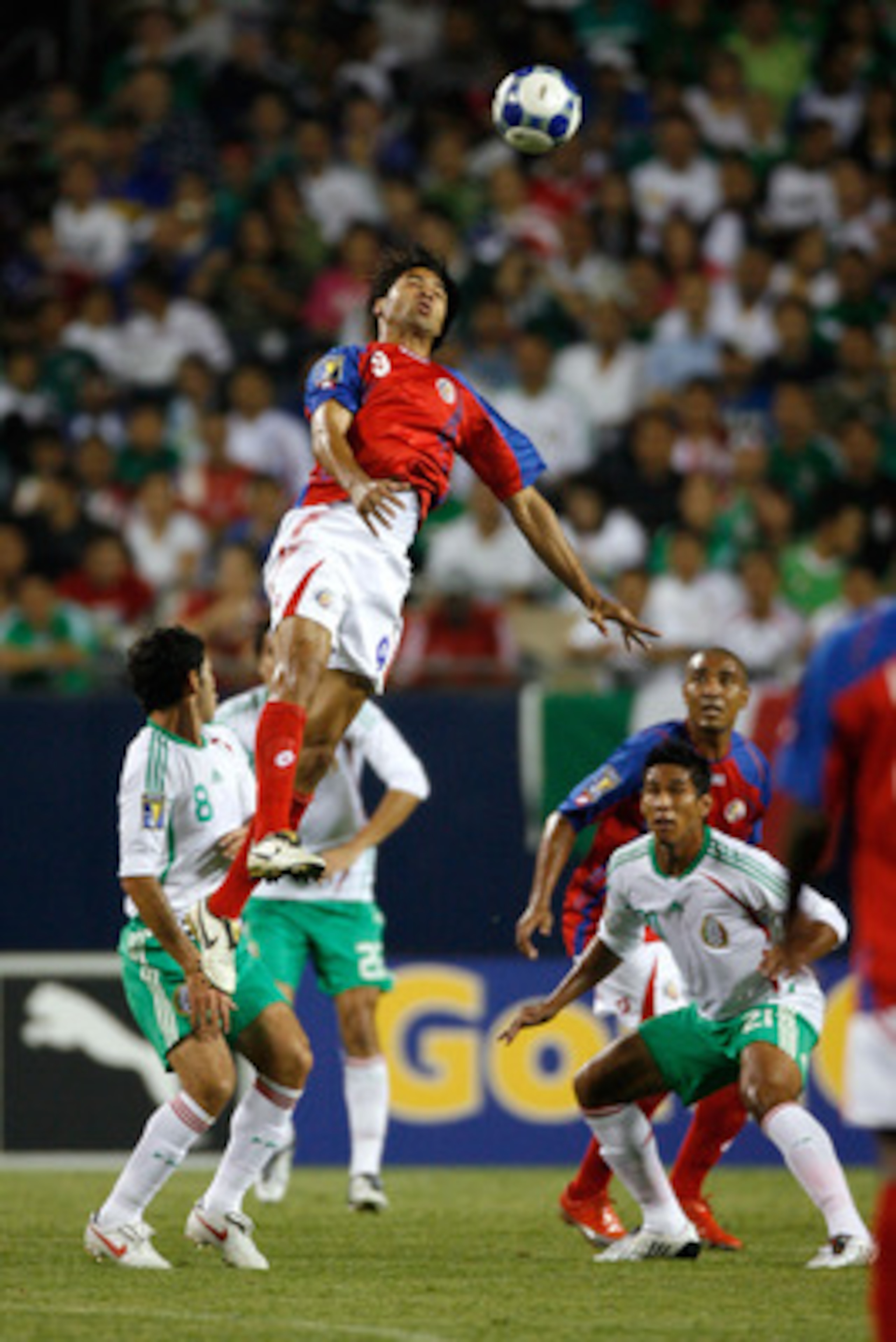 CHICAGO - JULY 23:  Alvaro Saborio #9 of Costa Rica heads the ball against Mexico during their CONCACAF Cup Semifinal match at Soldier Field on July 23, 2009 in Chicago, Illinois.  (Photo by Brian Kersey/Getty Images)