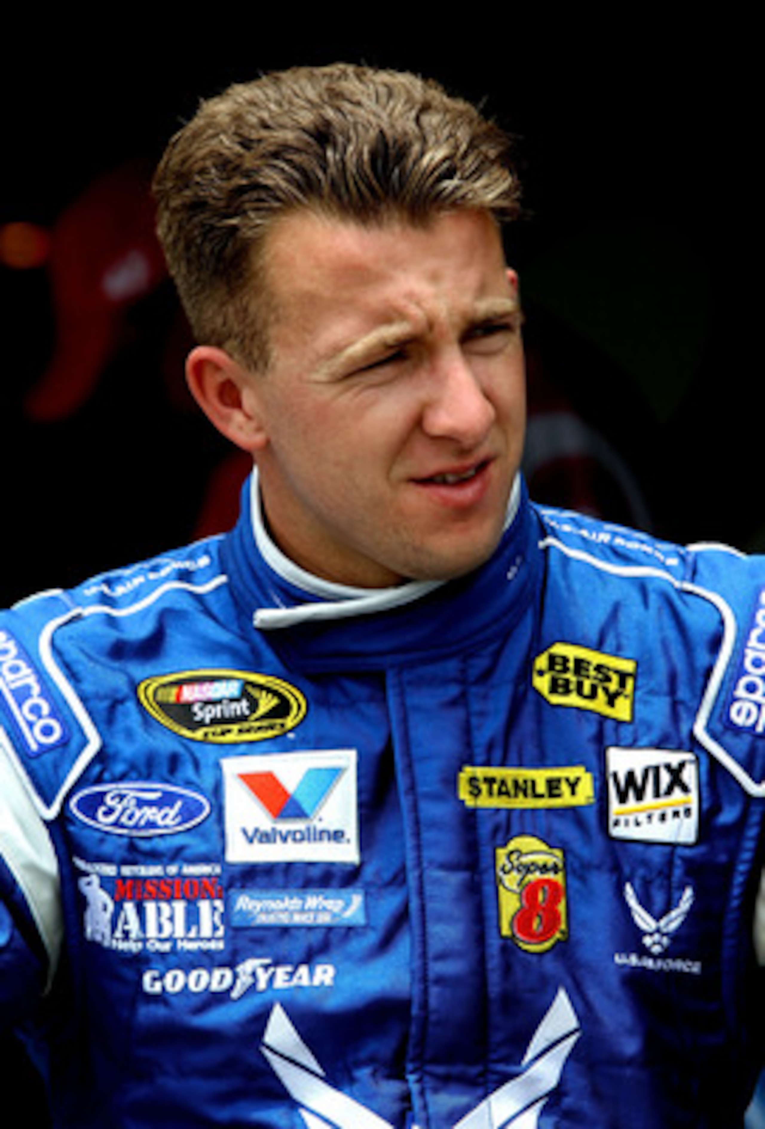 CHARLOTTE, NC - MAY 28:  A.J. Allmendinger, driver of the #43 U.S. Air Force Ford, sits in the garage area during practice for the NASCAR Sprint Cup Series Coca-Cola 600 at Charlotte Motor Speedway on May 28, 2011 in Charlotte, North Carolina.  (Photo by 