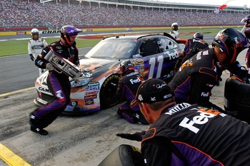 CONCORD, NC - MAY 29: Denny Hamlin, driver of the #11 FedEx Express Toyota, pits during the NASCAR Sprint Cup Series Coca-Cola 600 at Charlotte Motor Speedway on May 29, 2011 in Concord, North Carolina.  (Photo by Geoff Burke/Getty Images for NASCAR)