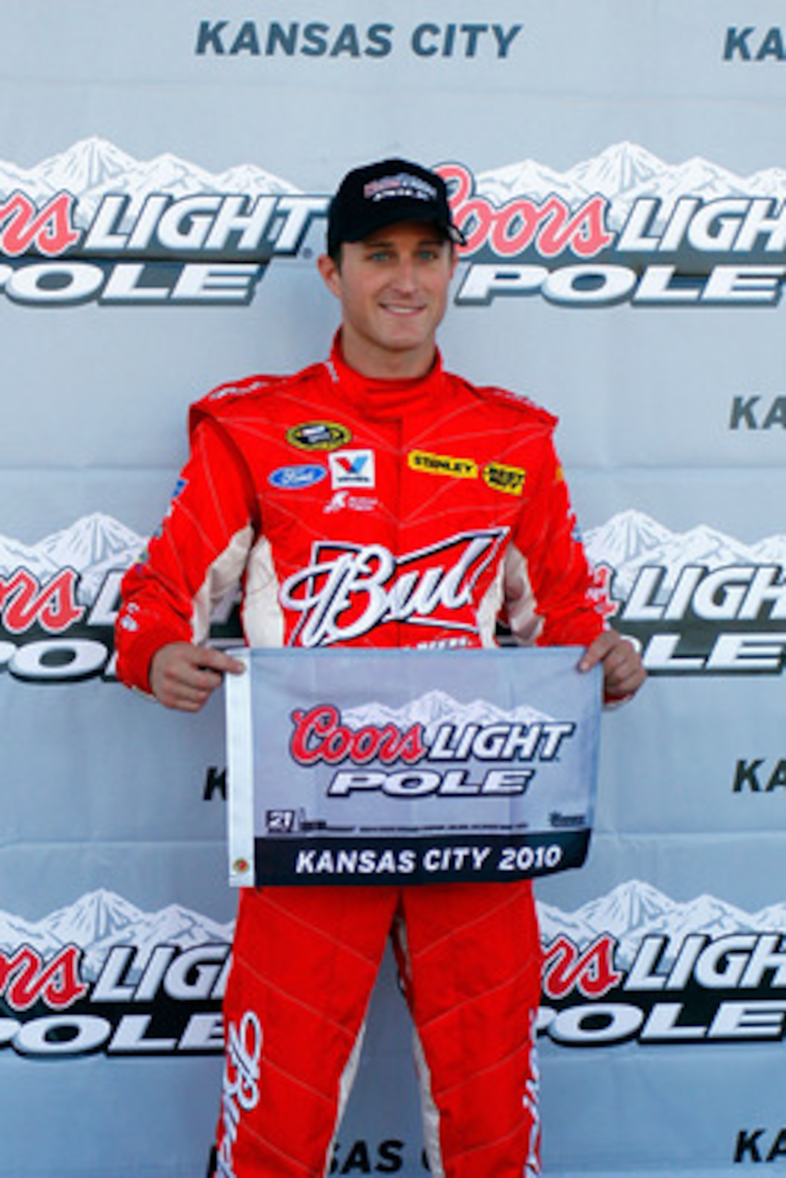 KANSAS CITY, KS - OCTOBER 01:  Kasey Kahne, driver of the #9 Budweiser Ford, celebrates winning the pole position for the NASCAR Sprint Cup Series Price Chopper 400 on October 1, 2010 in Kansas City, Kansas.  (Photo by Jason Smith/Getty Images for NASCAR)