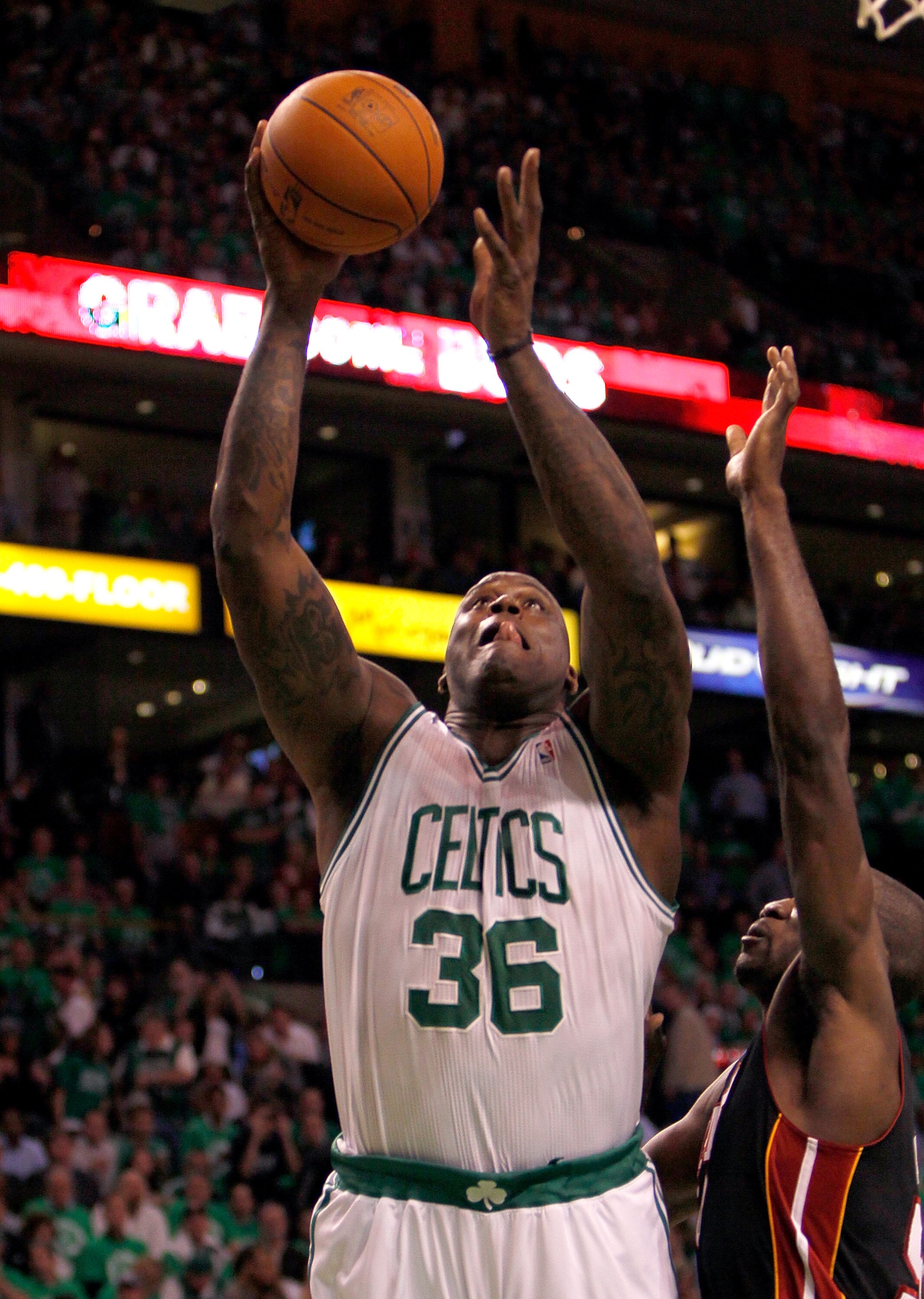 BOSTON, MA - OCTOBER 26: Shaquille O'Neal #36 of the Boston Celtics beats Dwyane Wade #3 of the Miami Heat to the basket at the TD Banknorth Garden on October 26, 2010 in Boston, Massachusetts. NOTE TO USER: User expressly acknowledges and agrees that, by