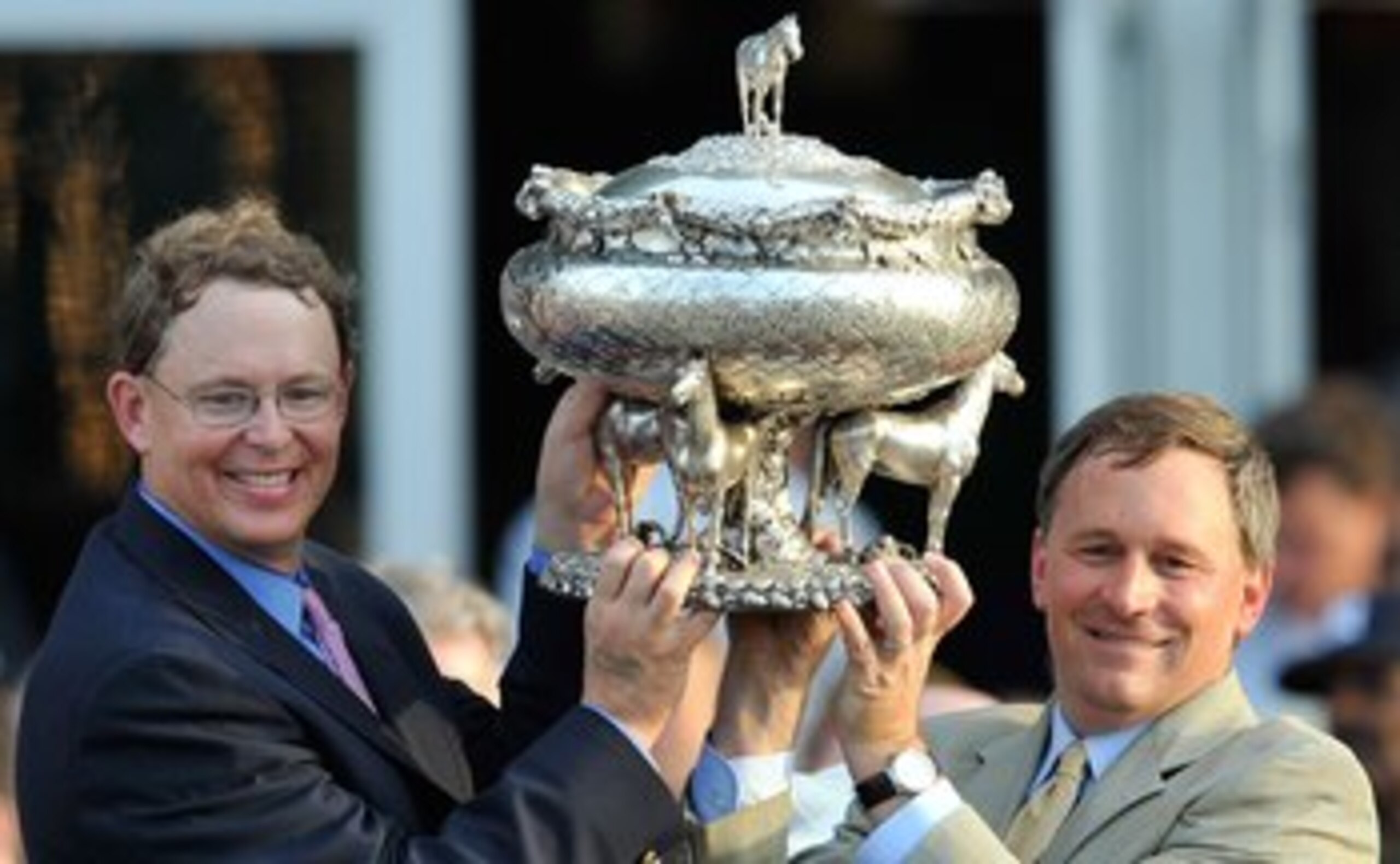 ELMONT, NY - JUNE 05:  Elliott Walden, Racing manager for WinStar Farms and trainer Bill Mott on the right hoist the Belmont trophy after their horse Drosselmeyer won the142nd Belmont Stakes at Belmont Park on June 5, 2010 in Elmont, New York.  (Photo by 