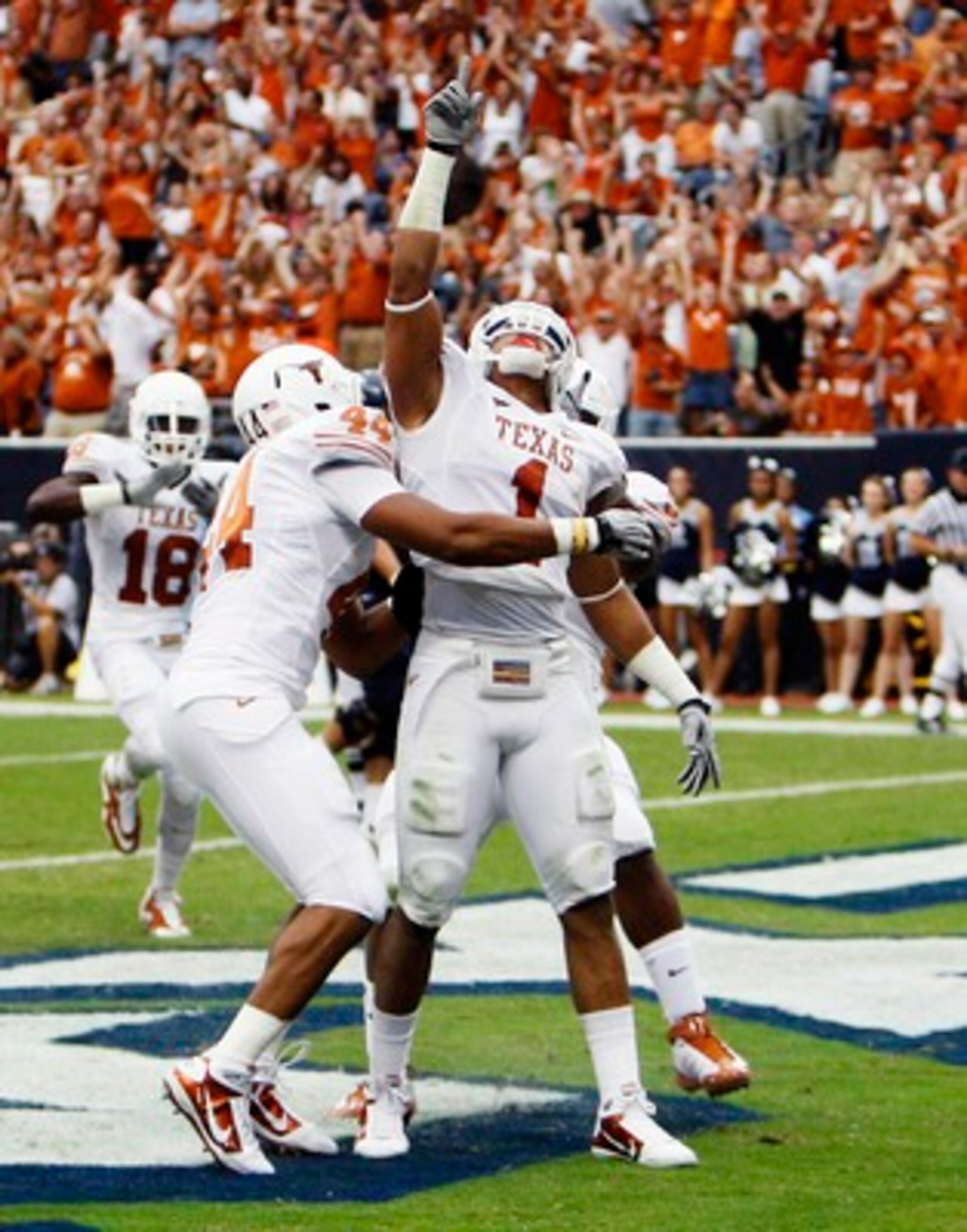HOUSTON - SEPTEMBER 04:  Linebacker Keenan Robinson #1 of the Texas Longhorns celebrates after running back a fumble for a touchdown against the Rice Owls at Reliant Stadium on September 4, 2010 in Houston, Texas.  (Photo by Bob Levey/Getty Images)